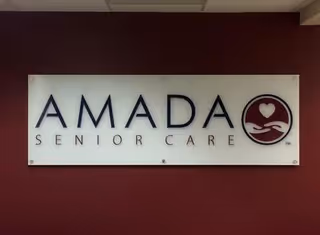 Exterior wall featuring the Amada Senior Care sign.