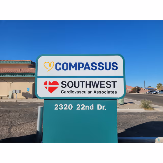 Outdoor sign shows Compassus and Southwest Cardiovascular Associates in a parking lot.