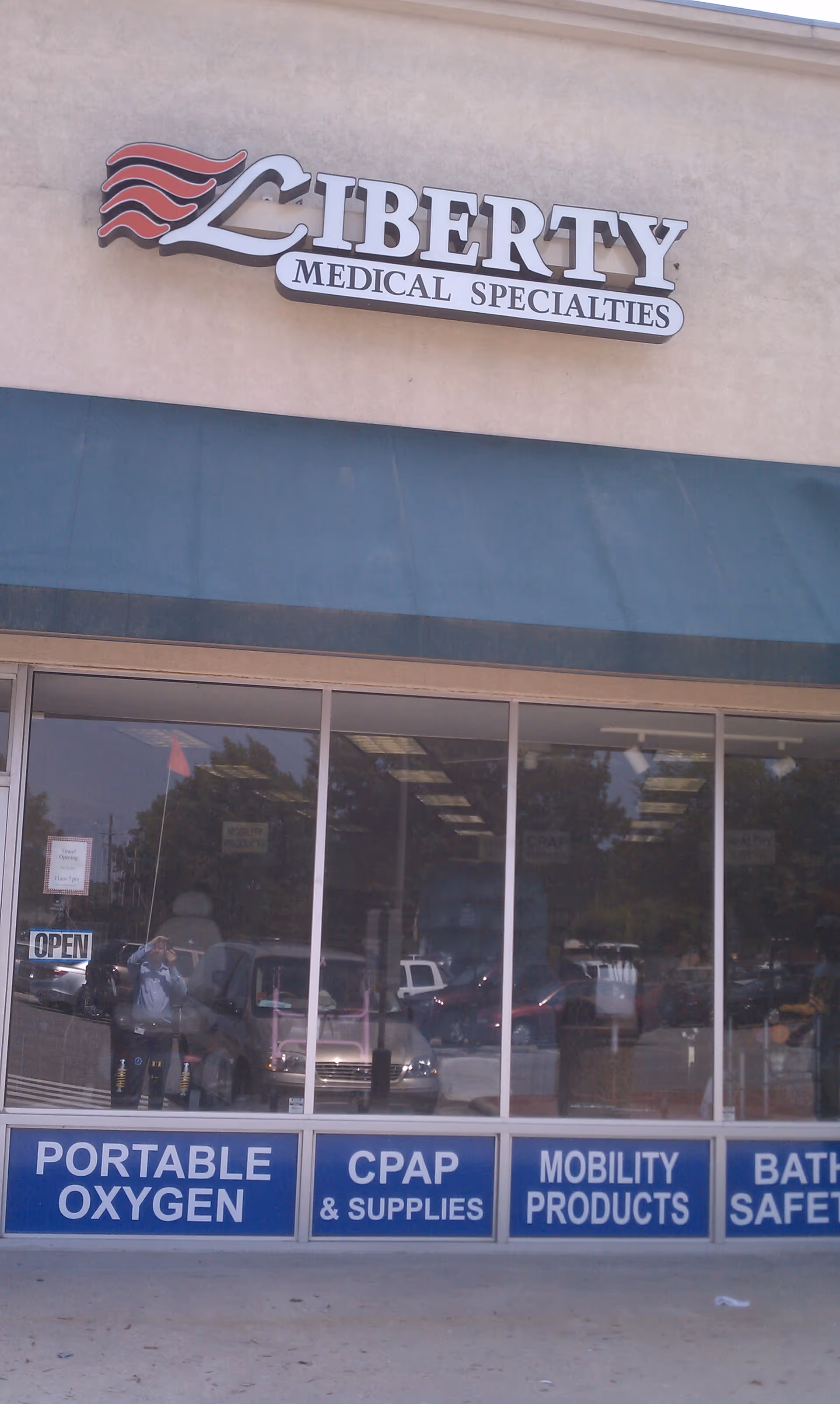 Exterior storefront of Liberty Medical Specialties with signage advertising portable oxygen and CPAP supplies.