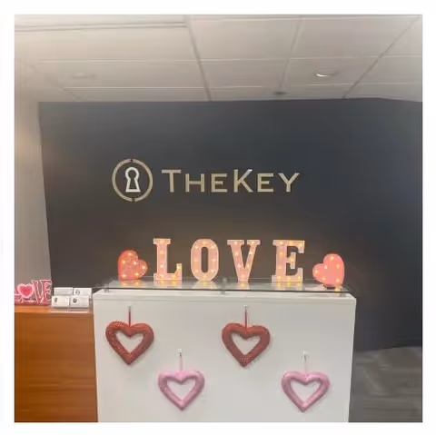 Indoor reception area at TheKey Senior Home Care with heart-themed decor.