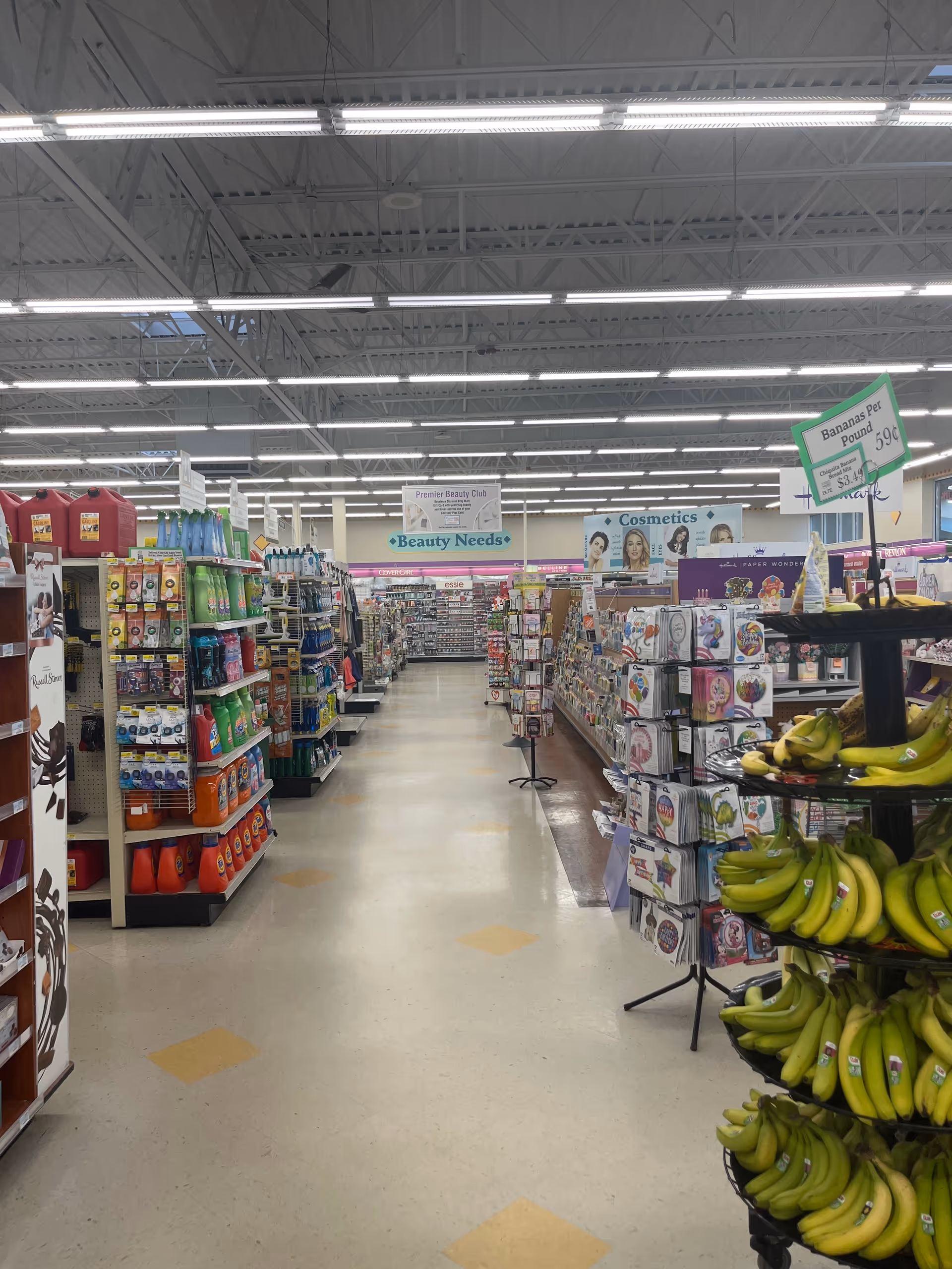 Interior of a Discount Drug Mart store with aisles and banana display.