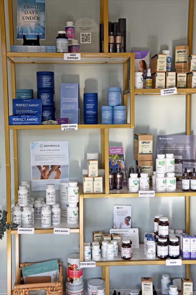 Interior wall shelving displaying numerous health supplements and labeled wellness products.