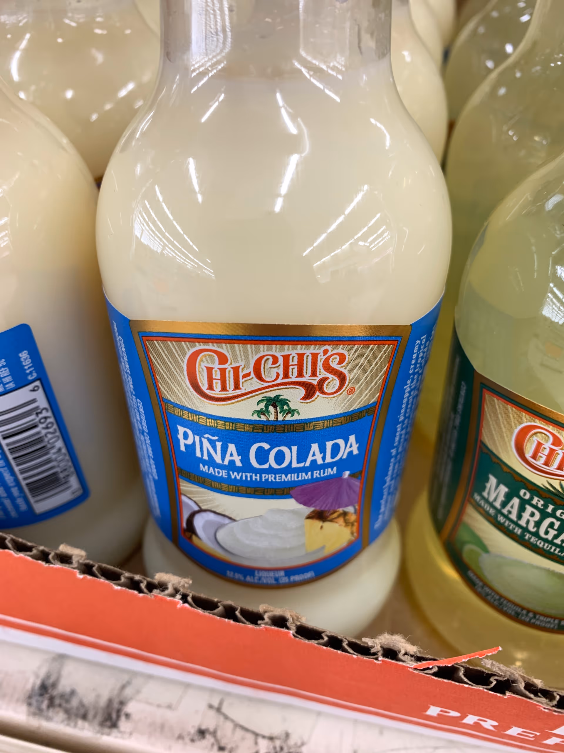 Close-up of Chi-Chi's Piña Colada bottle on a store shelf