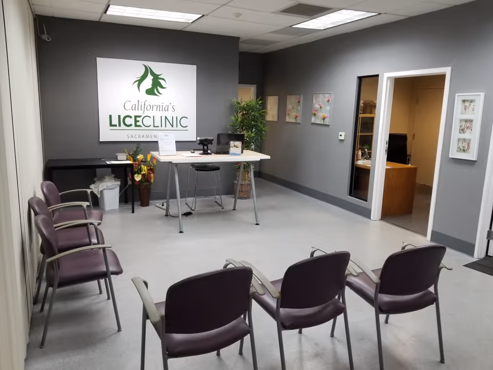 Reception area of California's Lice Clinic with a desk, chairs, and wall sign.