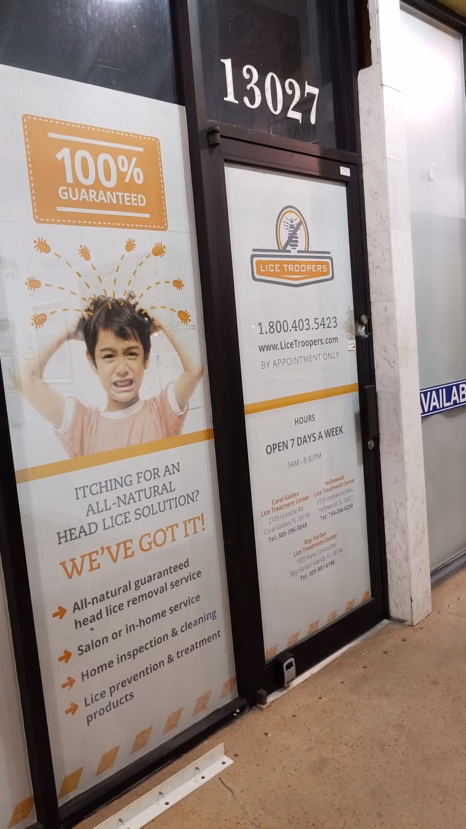 Storefront for Lice Troopers clinic with large signs and address number 13027