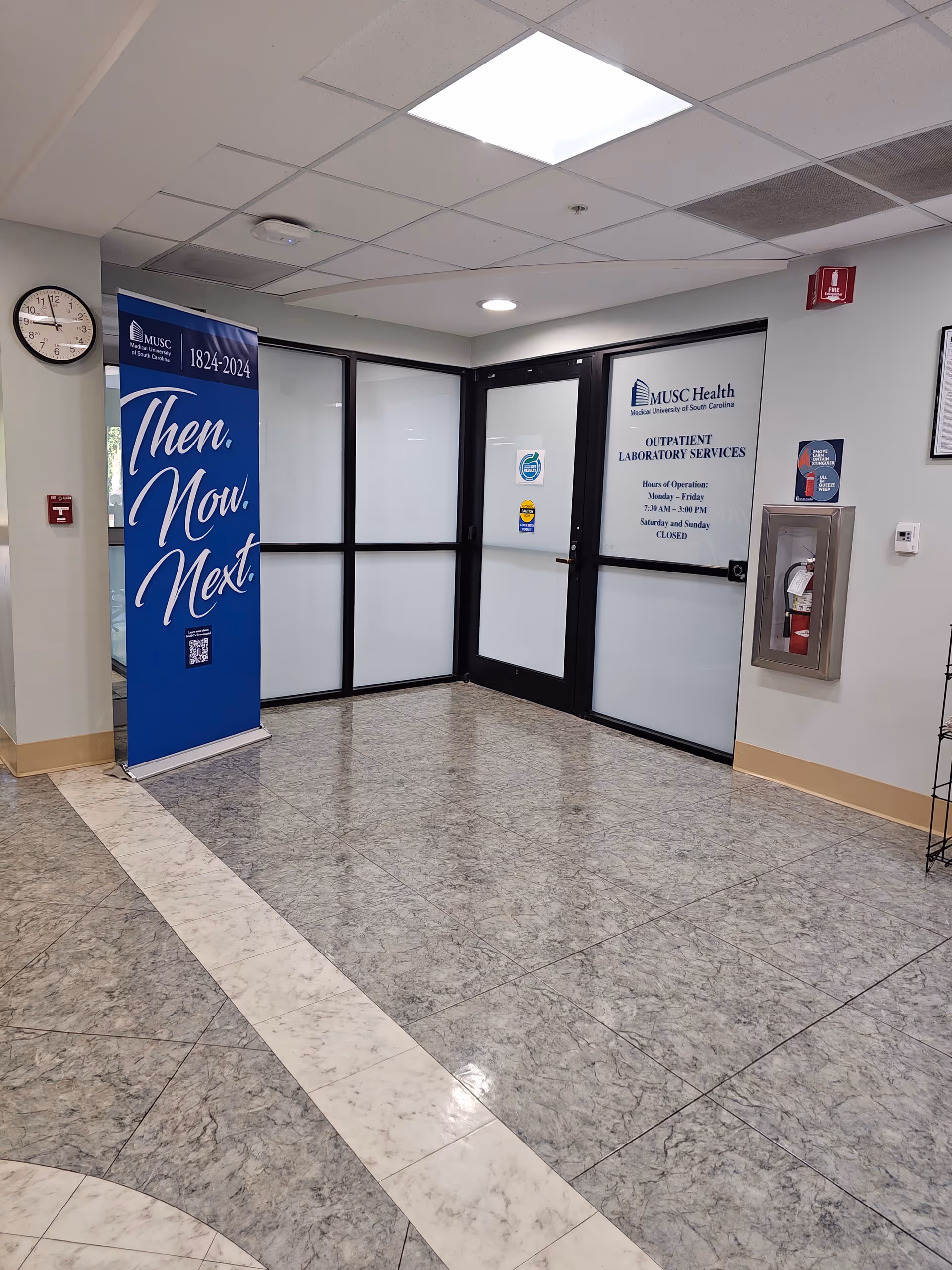 MUSC Health Kershaw Medical Center corridor with glass doors and an informational banner.