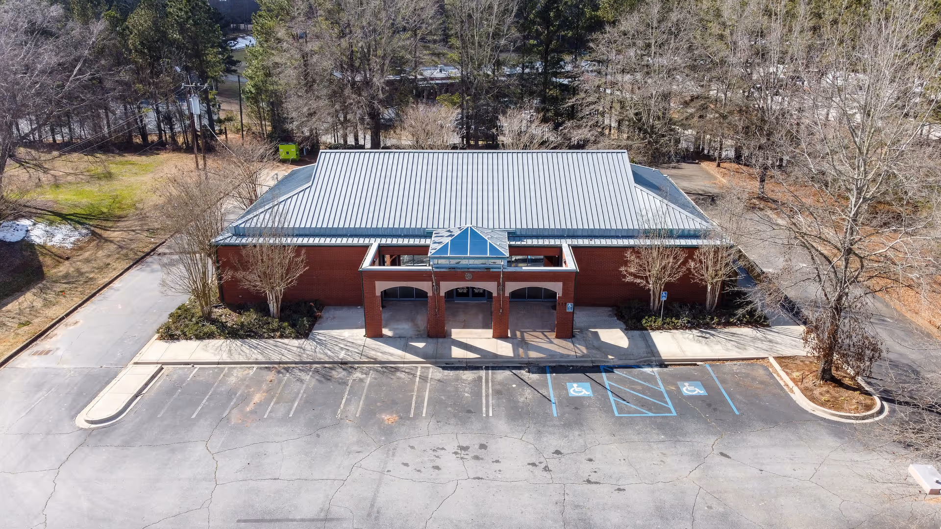 Aerial view of Elite Home Care and Day Centers building with brick exterior and accessible parking.