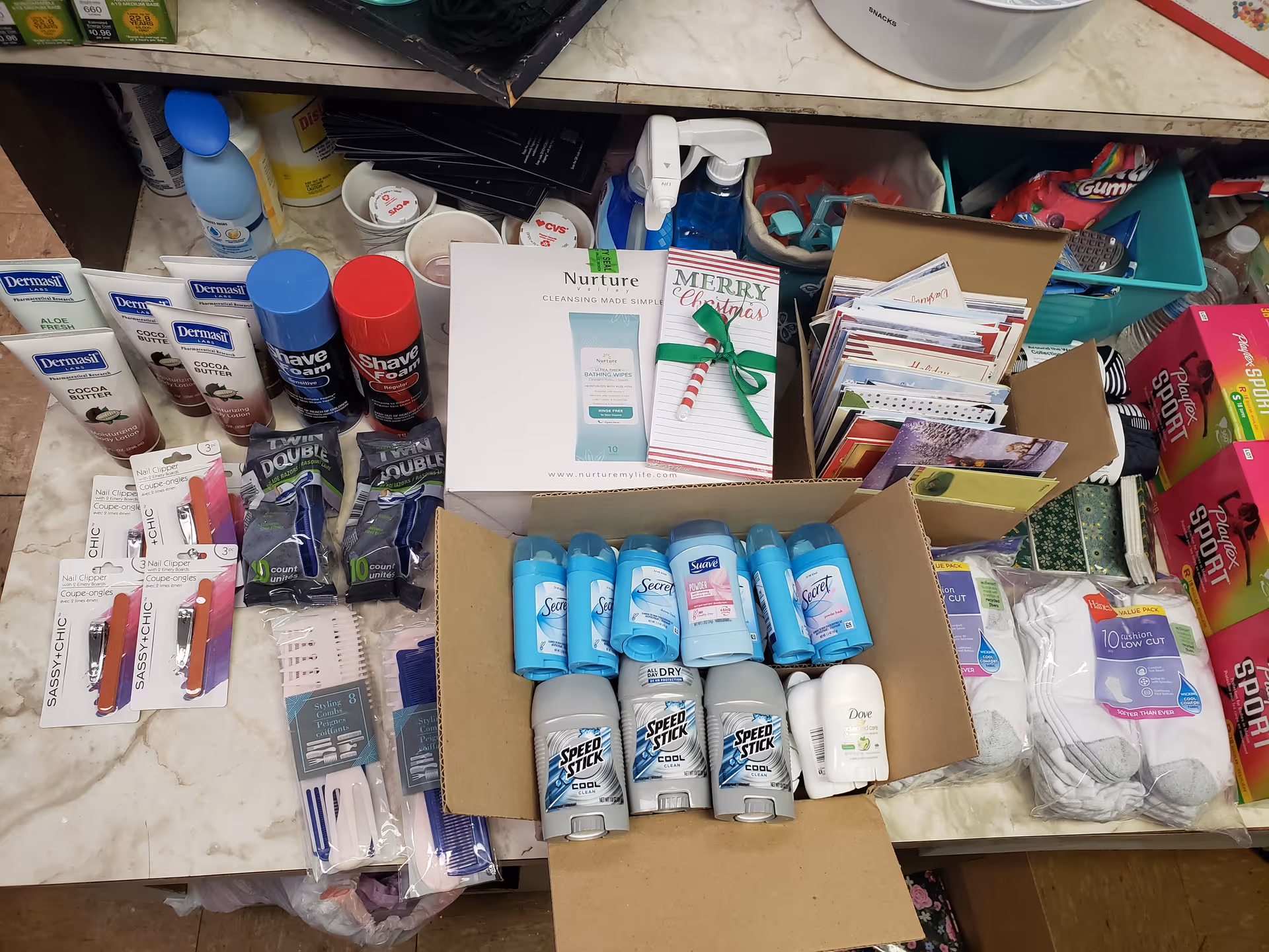 Cluttered interior shelf filled with personal care products and household supplies.