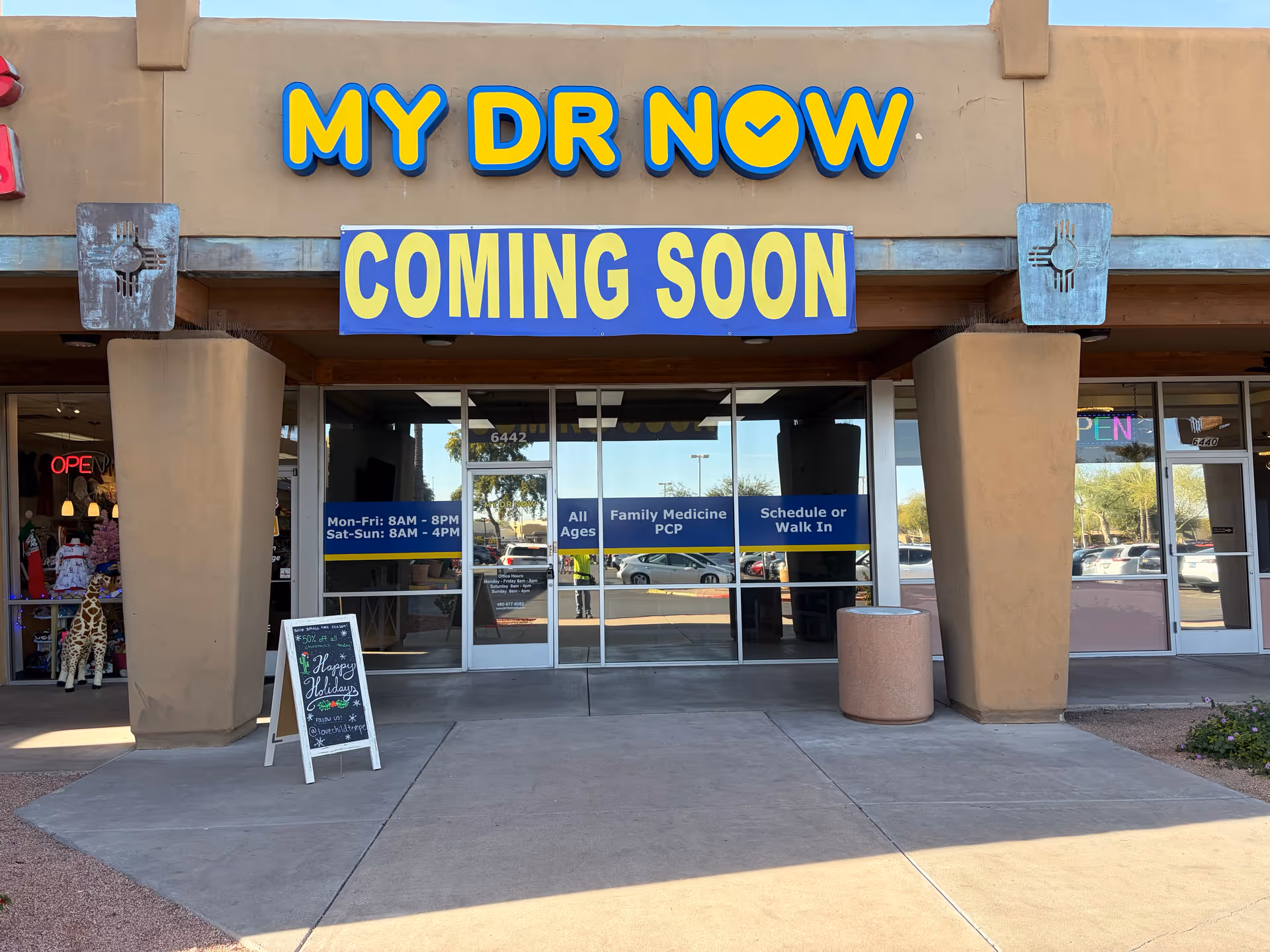 Front of a My Dr Now clinic with a Coming Soon banner and glass doors.
