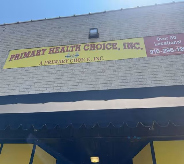 Exterior view of a building with a yellow Primary Health Choice sign.