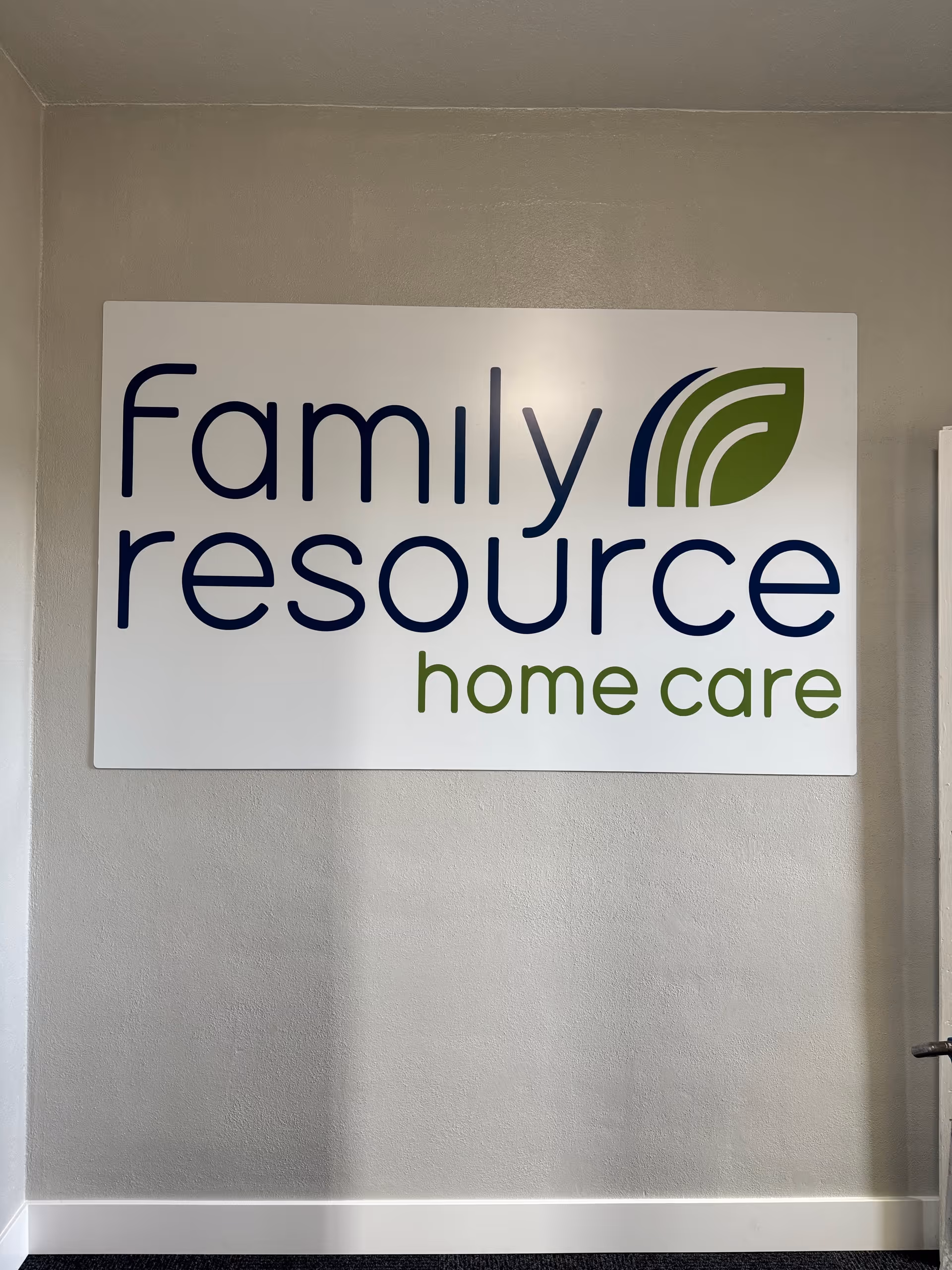 Interior wall featuring a large Family Resource Home Care sign.