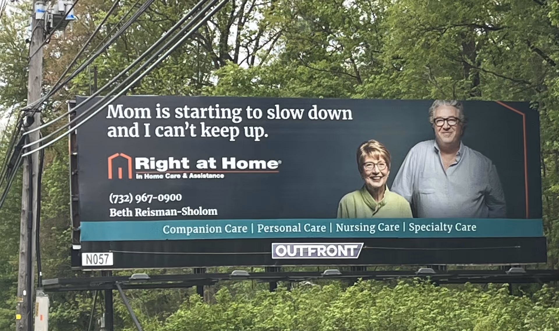 Outdoor billboard for Right at Home featuring smiling seniors