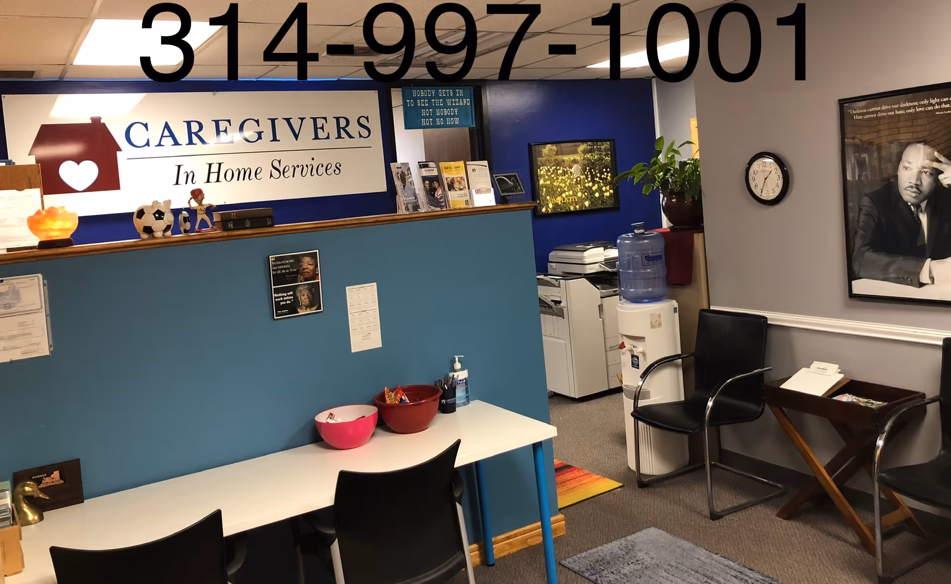Reception area featuring the Caregivers in Home Services sign and seating.