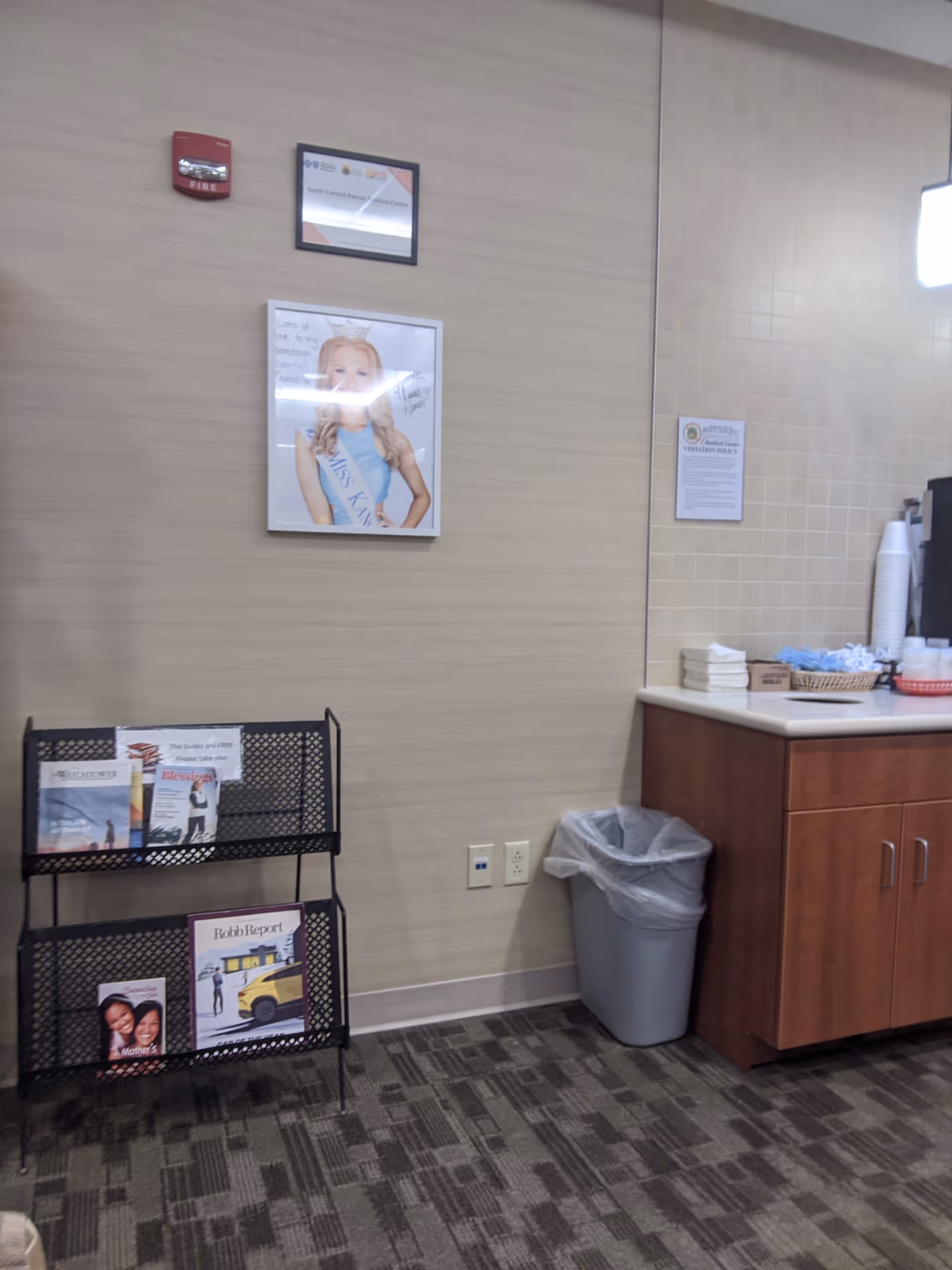 Interior of a senior facility lobby featuring a brochure rack and counter.