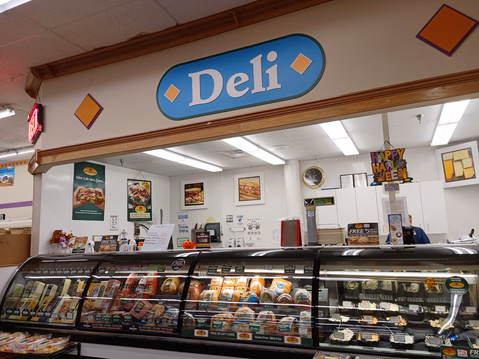 Interior view of a Discount Drug Mart deli counter with a glass display case.