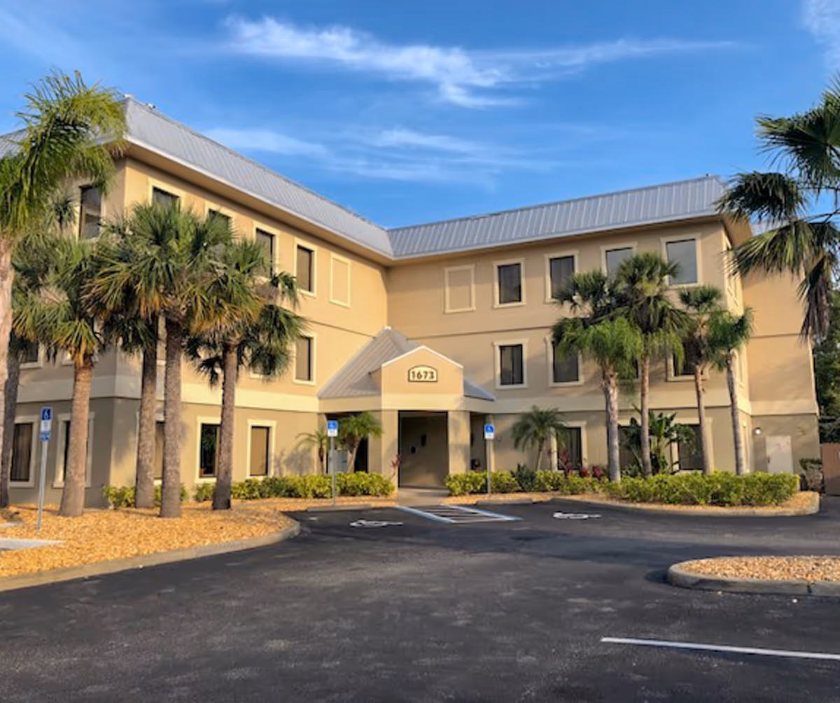Exterior of Brooks Rehabilitation Home Health Daytona Beach with palms and entrance
