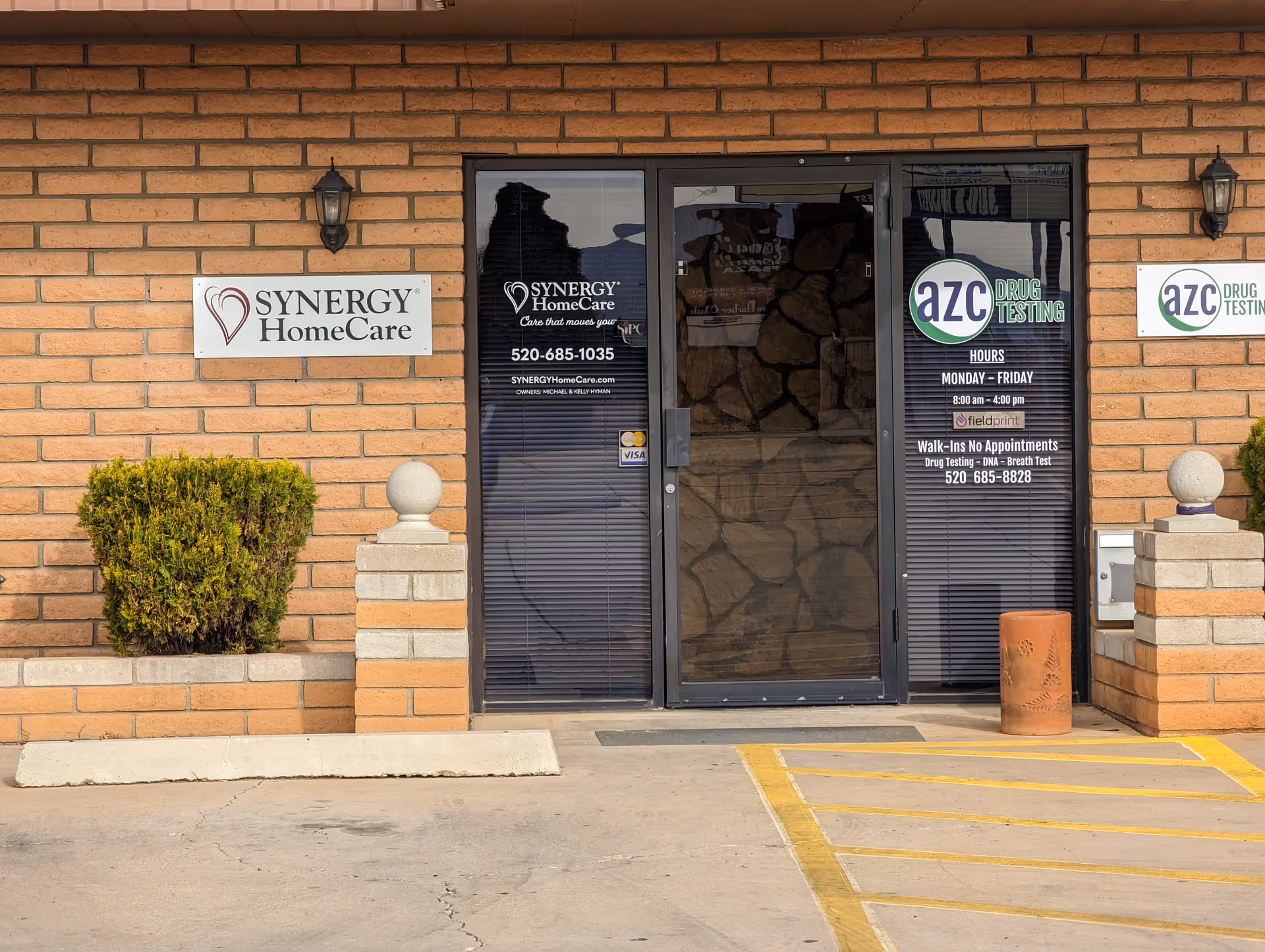 Brick building exterior with Synergy HomeCare entrance and adjacent signage.