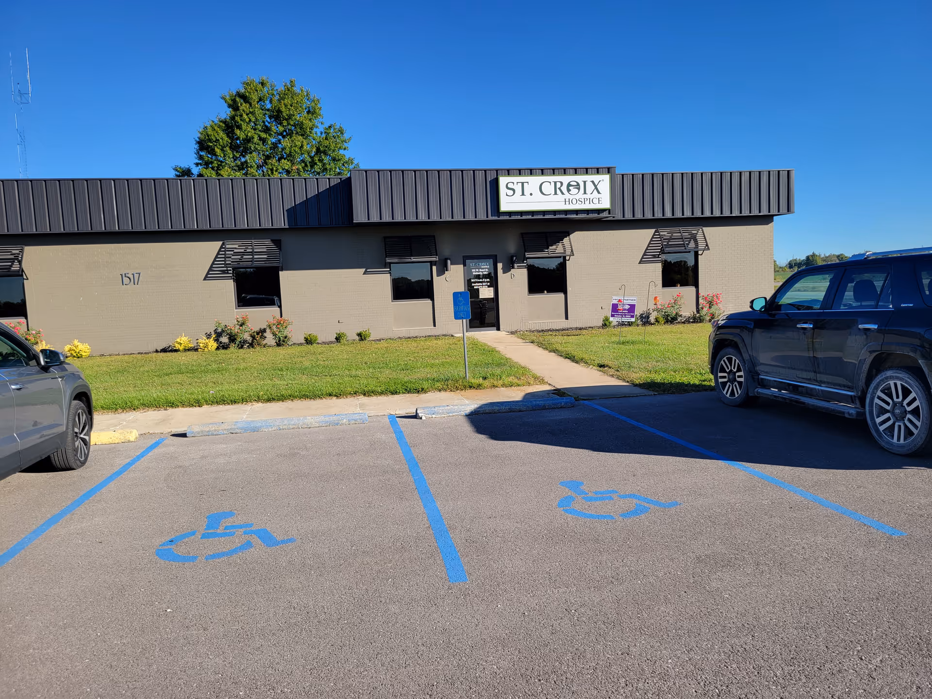 Exterior view of St. Croix Hospice building with accessible parking in front.