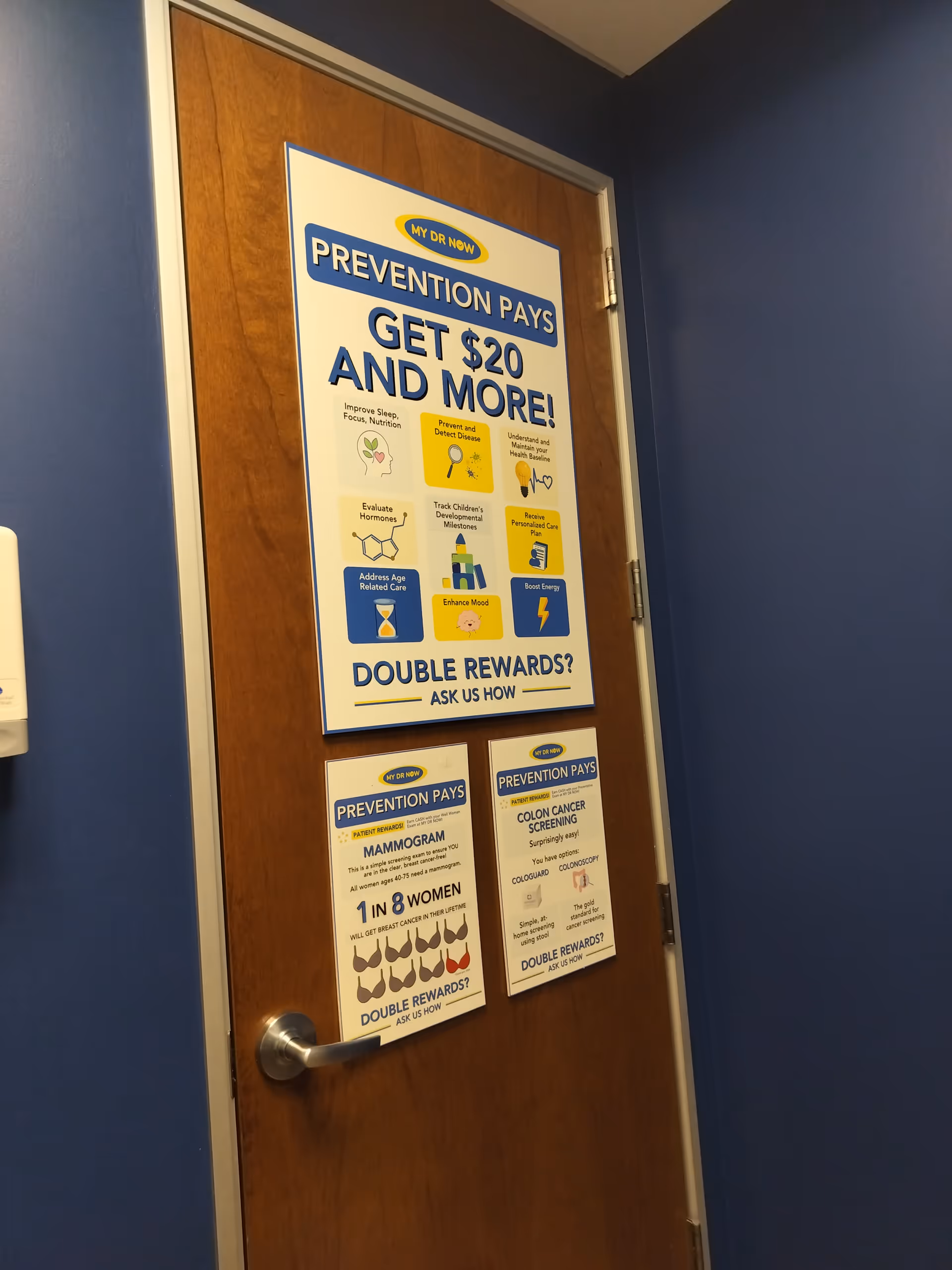 Wooden door in blue hallway covered with prevention posters.