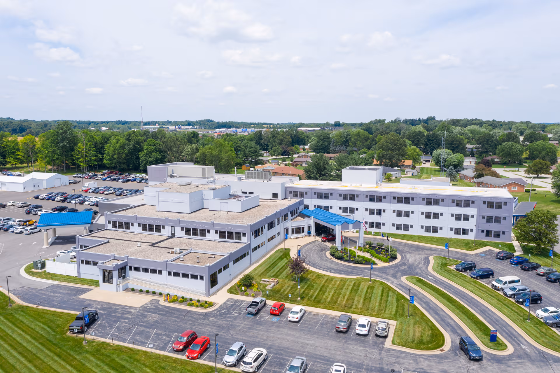 Aerial view of Highland District Hospital campus with parking areas and green lawns.