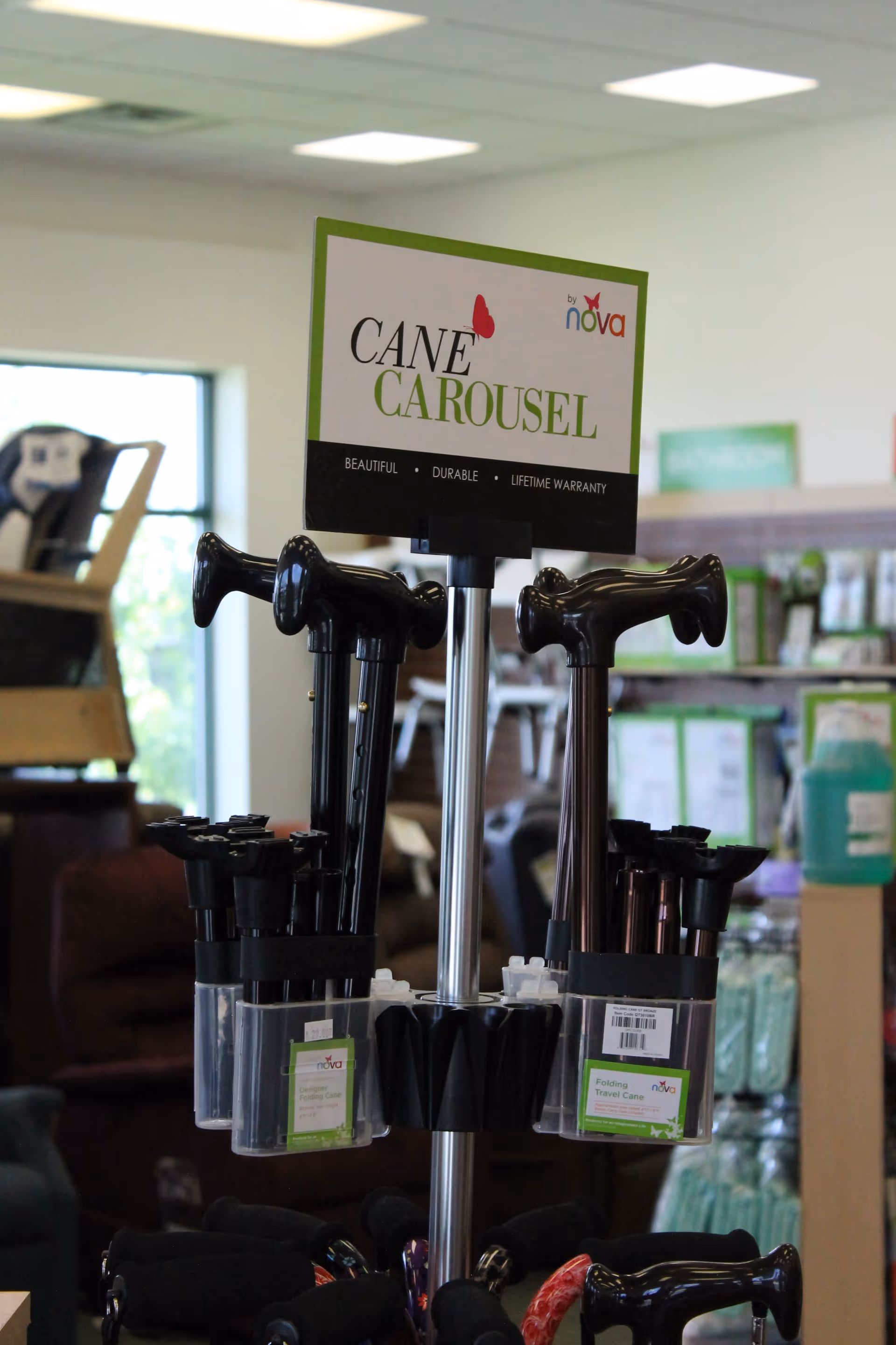 Indoor display of a Cane Carousel with black canes and signage.