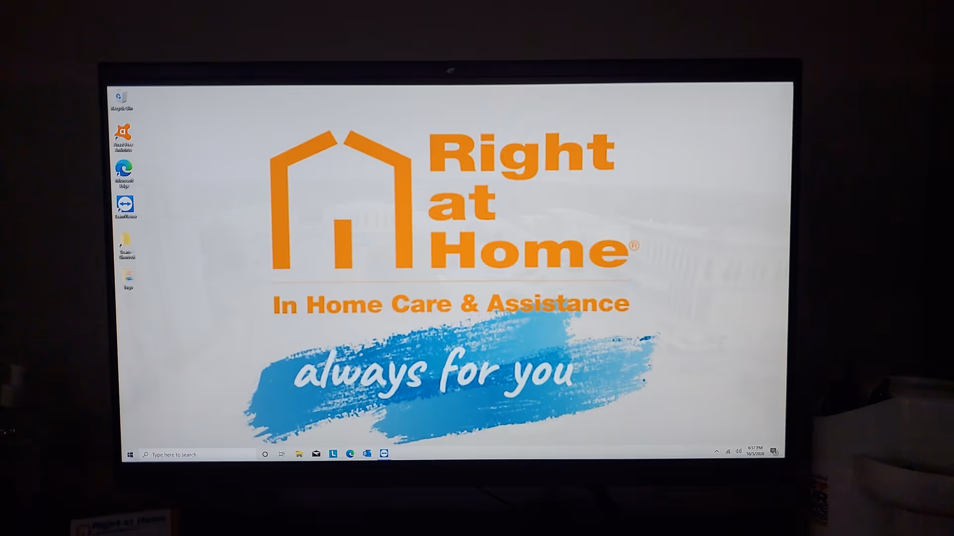 A computer monitor displays the Right at Home logo with the Always for you slogan.
