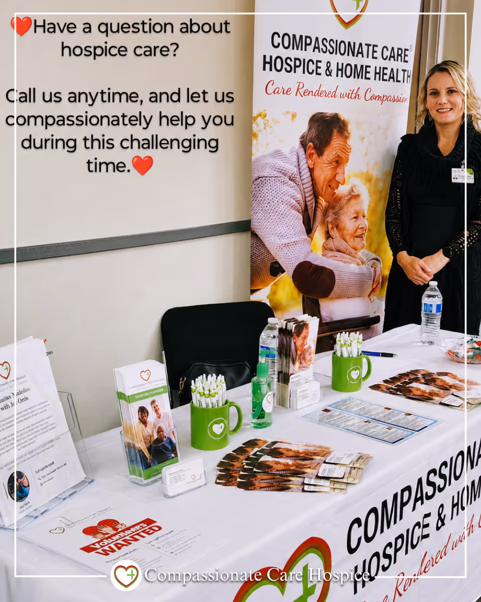 Indoor hospice information booth with banners, brochures, and staff at Compassionate Care Hospice Inland Empire.