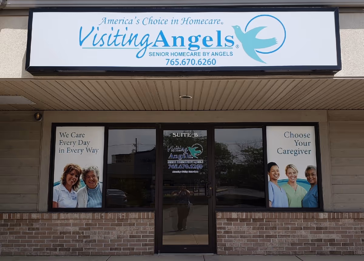 Visiting Angels storefront with logo sign, front entrance, and caregiver posters in windows.