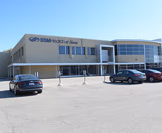 Exterior view of SSM Health at Home building with cars in the parking lot.