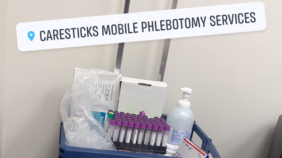 A cart of phlebotomy supplies beneath a CareSticks sign in a clinical interior.