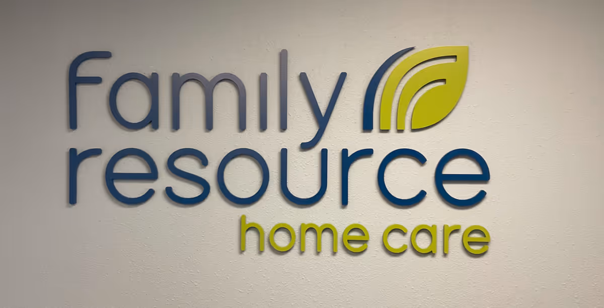 Interior wall featuring the 'Family Resource Home Care' logo.