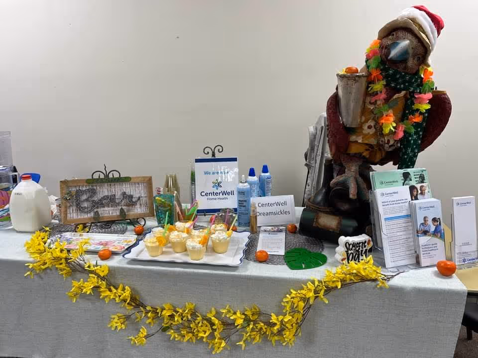 Promotional display table with CenterWell materials and festive decorations indoors.