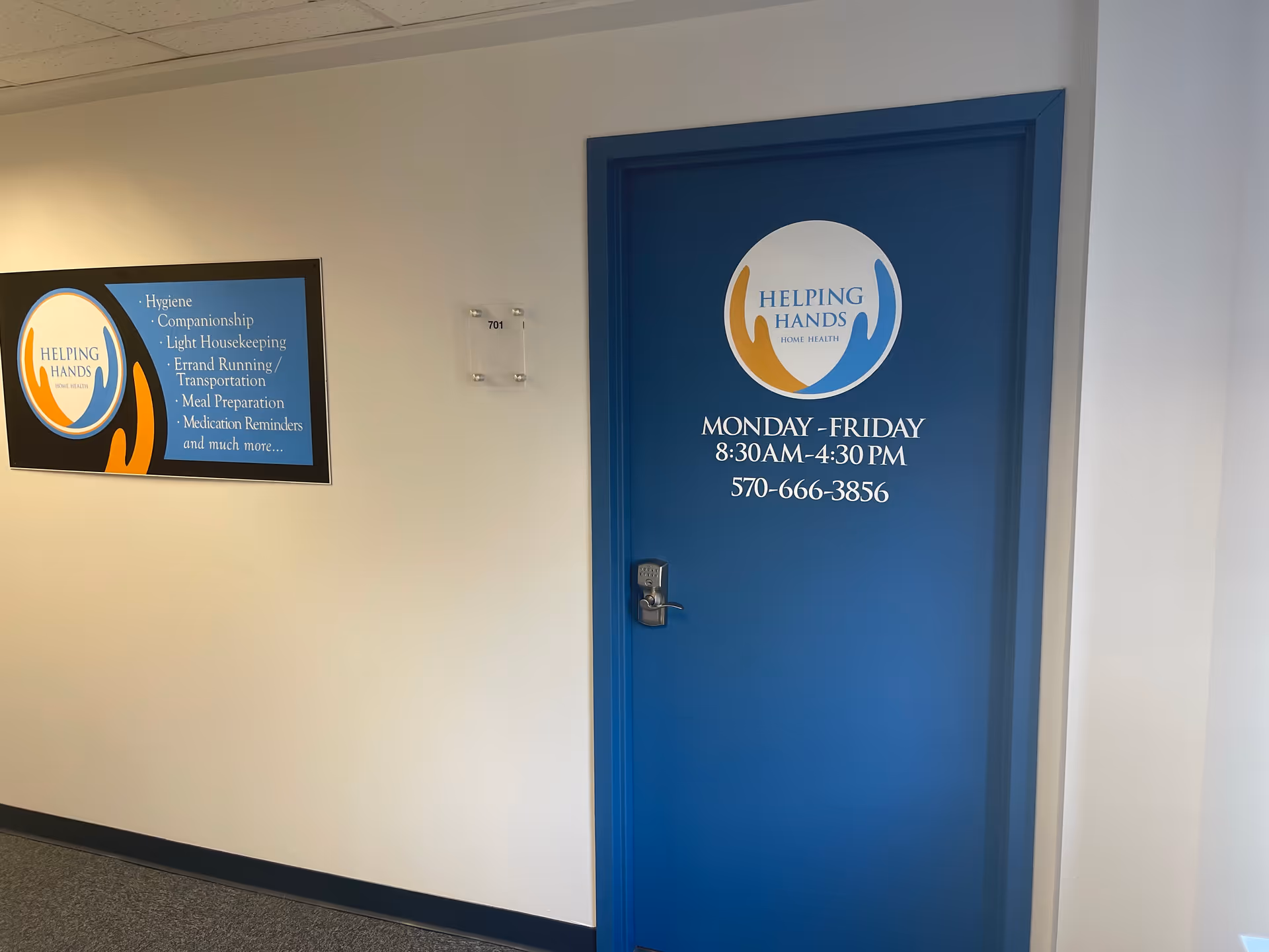 Blue door with Helping Hands Home Health logo and operating hours in hallway.