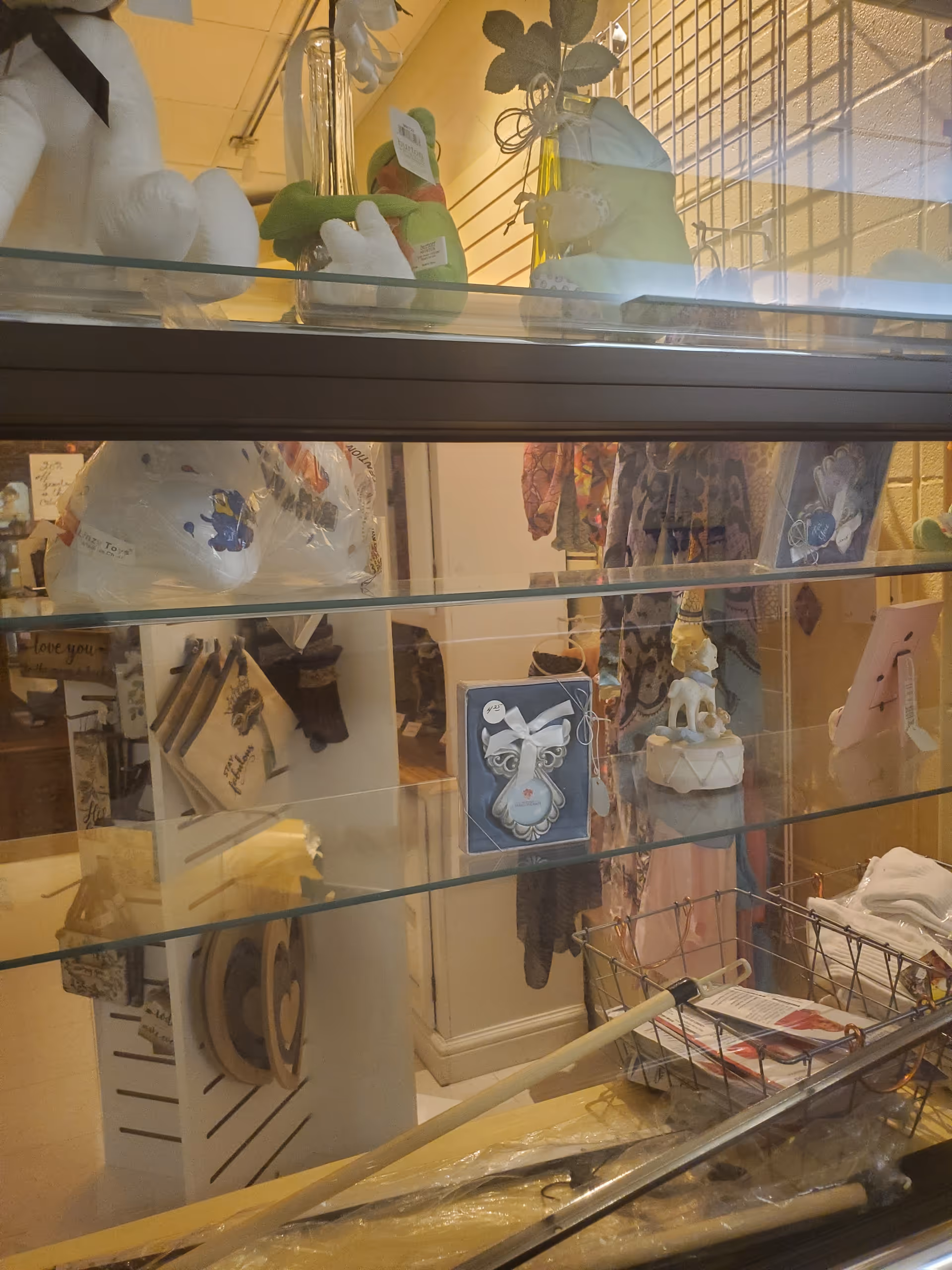 Inside West Calcasieu Cameron Hospital gift shop, glass shelves display cards and decorative items.