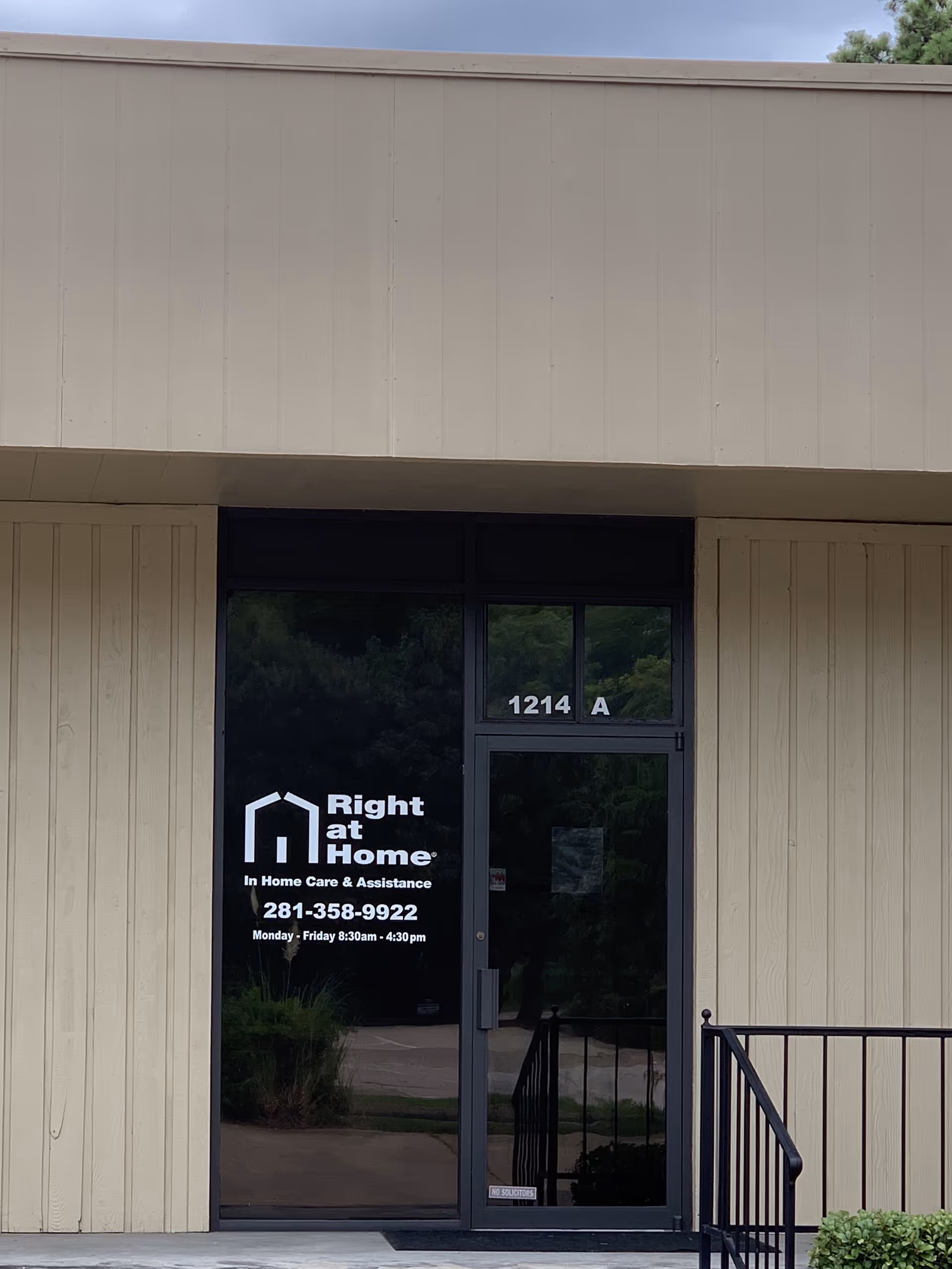 Front entrance of Right at Home facility with glass doors and address 1214 A