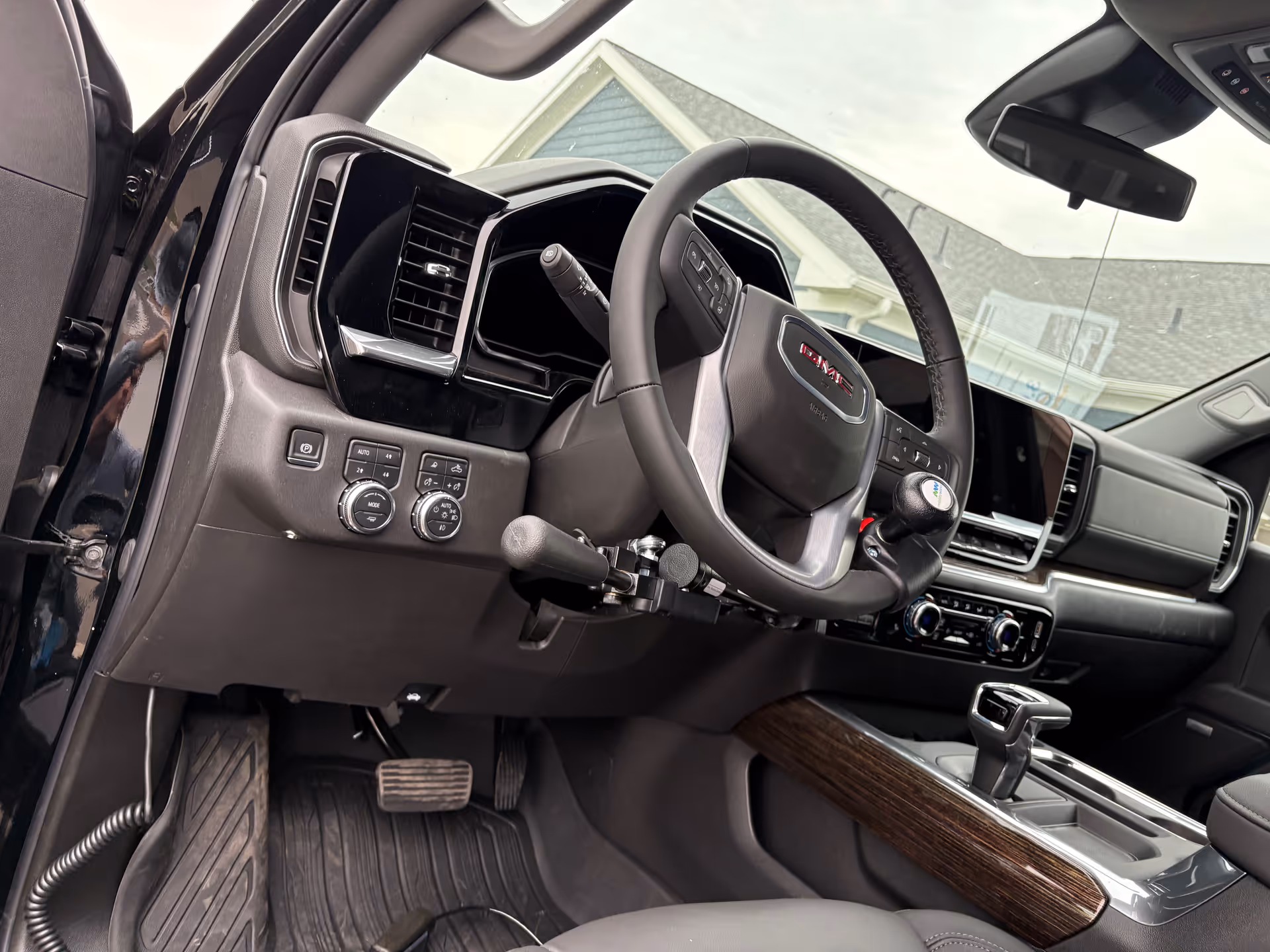 Car interior with steering wheel and dashboard, center console visible