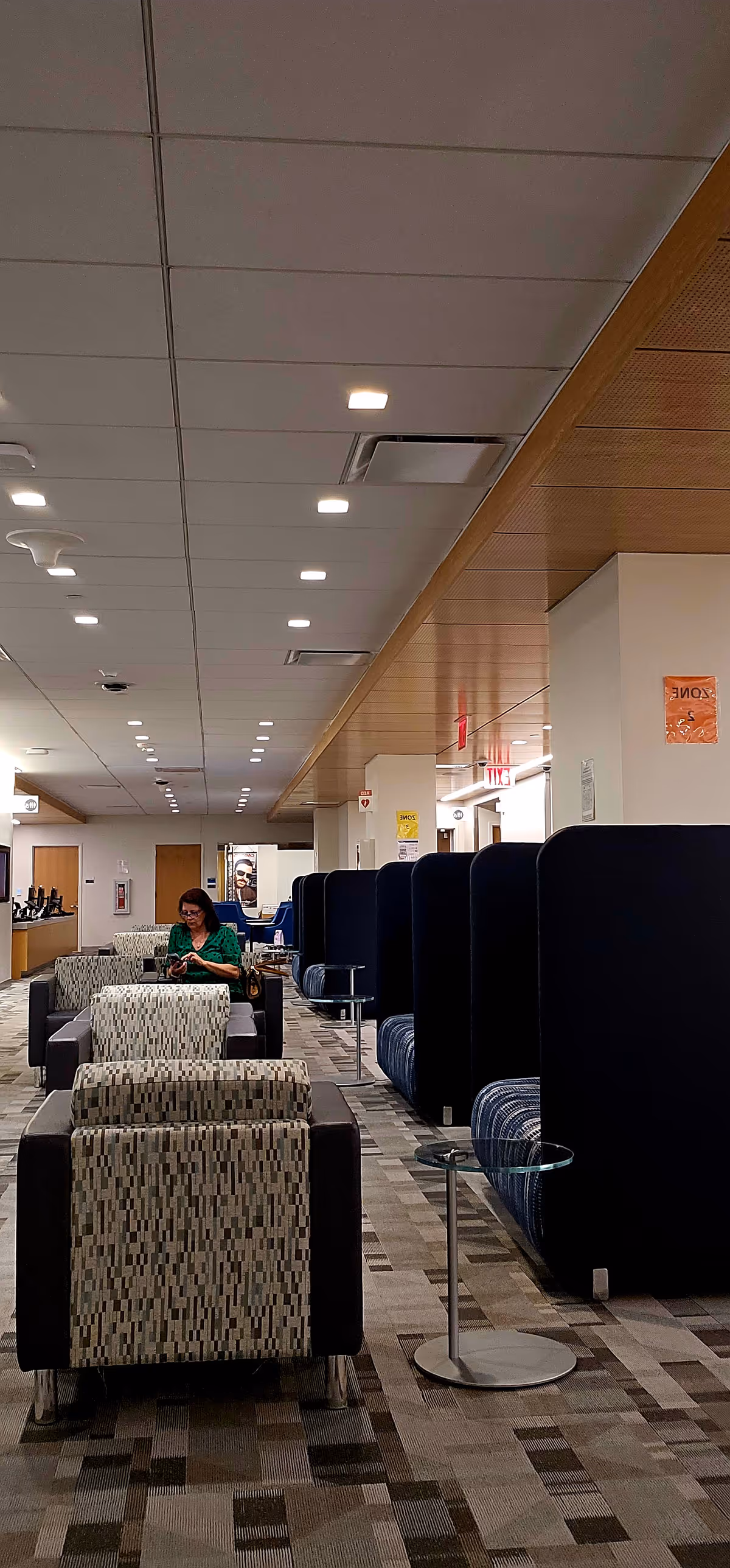 Interior waiting area of Steinberg Ambulatory Care Center Cobble Hill with patterned chairs and a resident.
