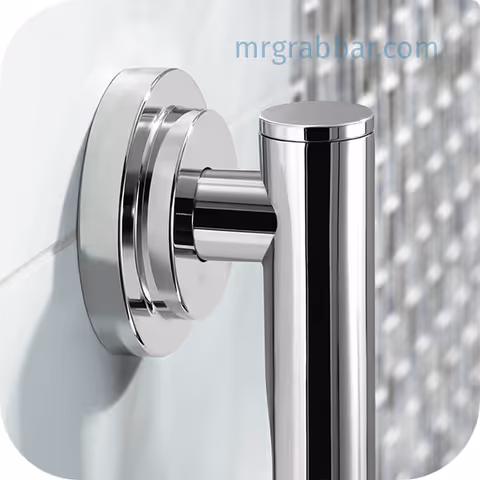 Close-up of a chrome grab bar mounted to a tiled bathroom wall.
