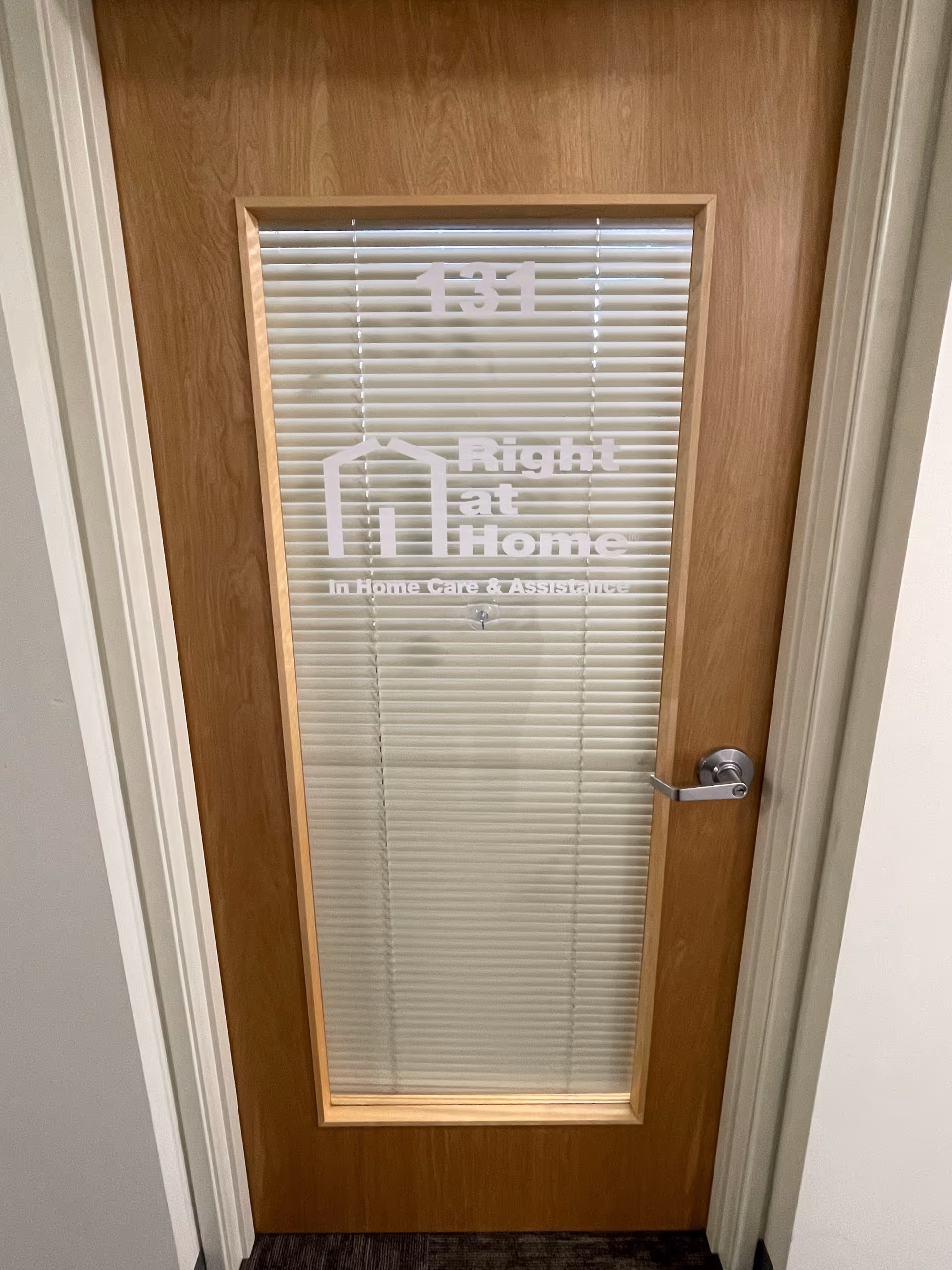 Interior door with blinds, room number 131, and Right at Home logo.