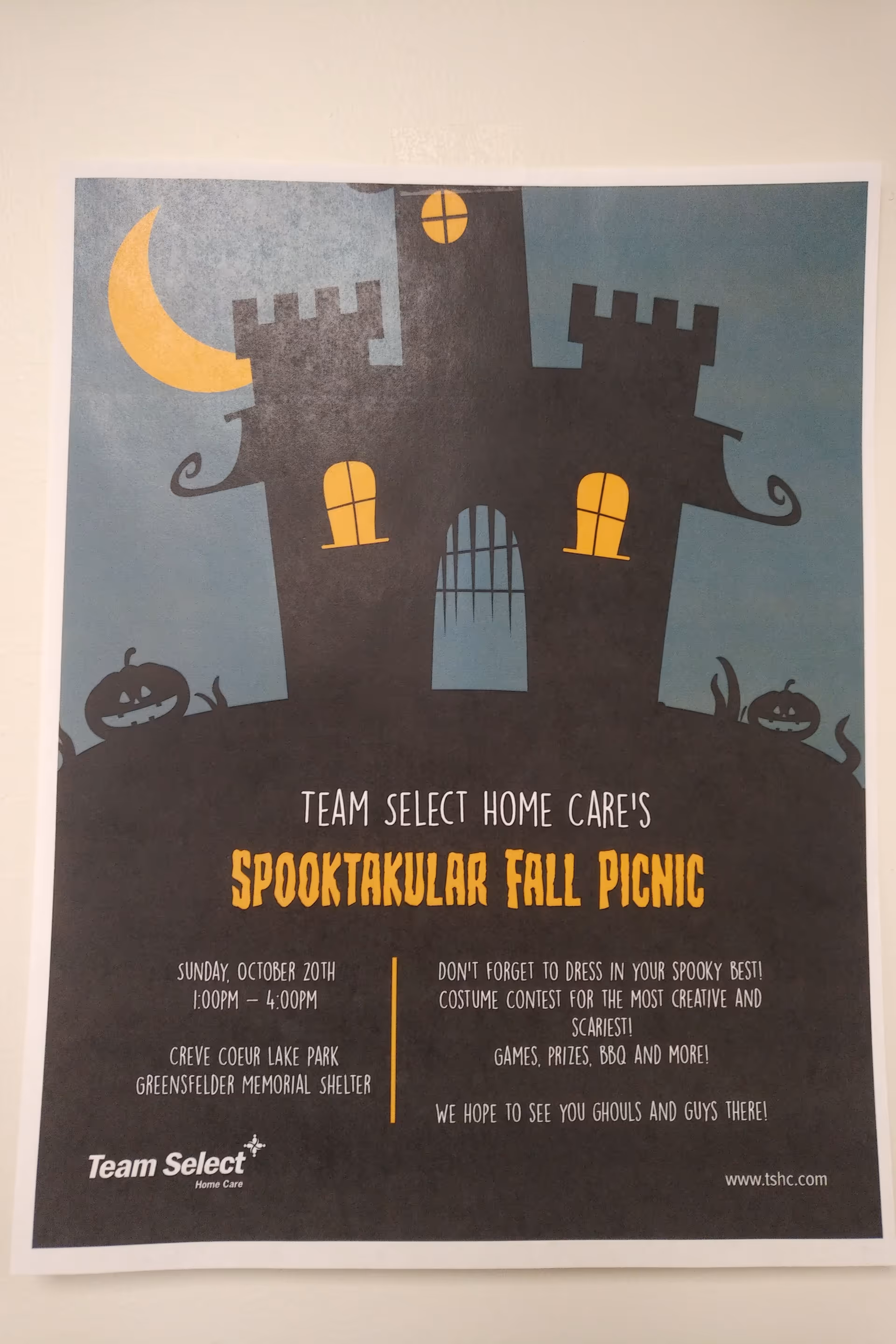 Poster on wall advertising Team Select Home Care's Spooktacular Fall Picnic event.