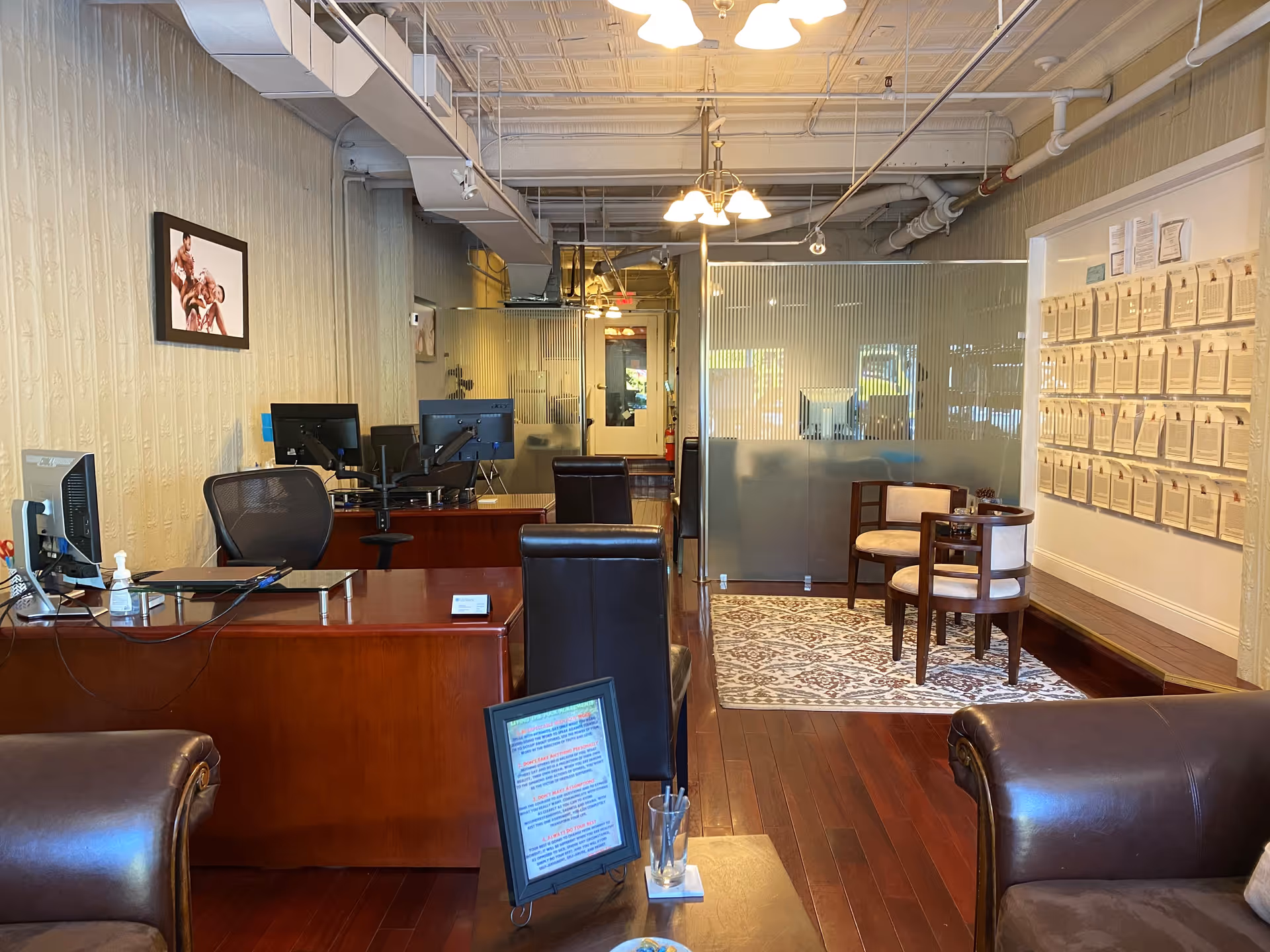Reception lobby of LifeWorx Home Care with desks, computers, and seating area.