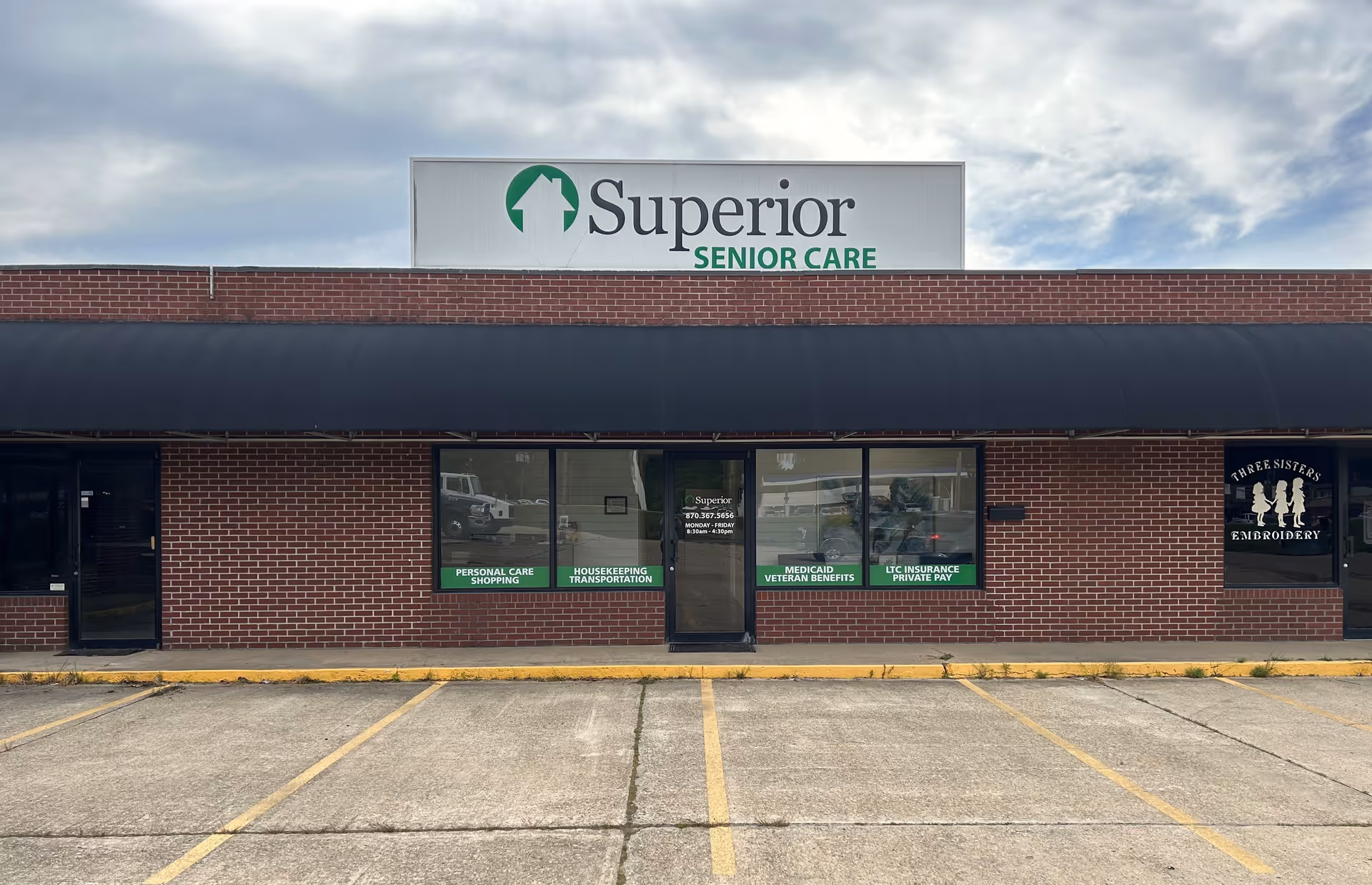 Brick storefront with Superior Senior Care sign and large front windows under a black awning.