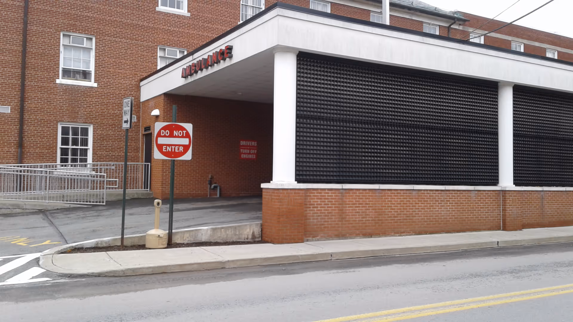 Exterior of Wayne Memorial Hospital with emergency entrance canopy and do-not-enter sign.