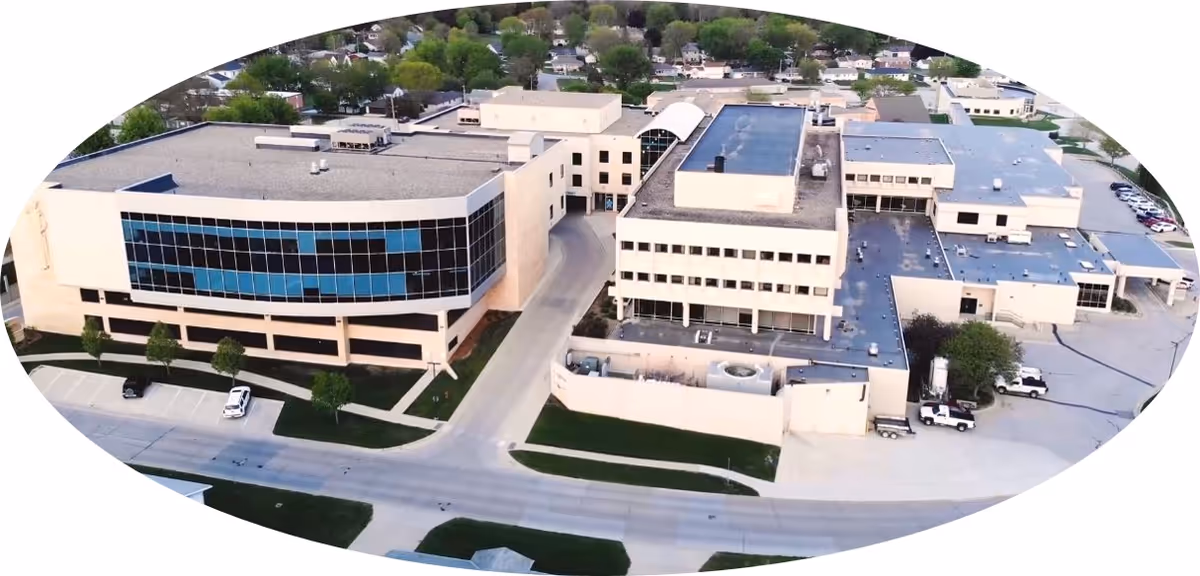 Aerial view of St Anthony Regional Hospital campus, showing multiple buildings, parking, and greenery.