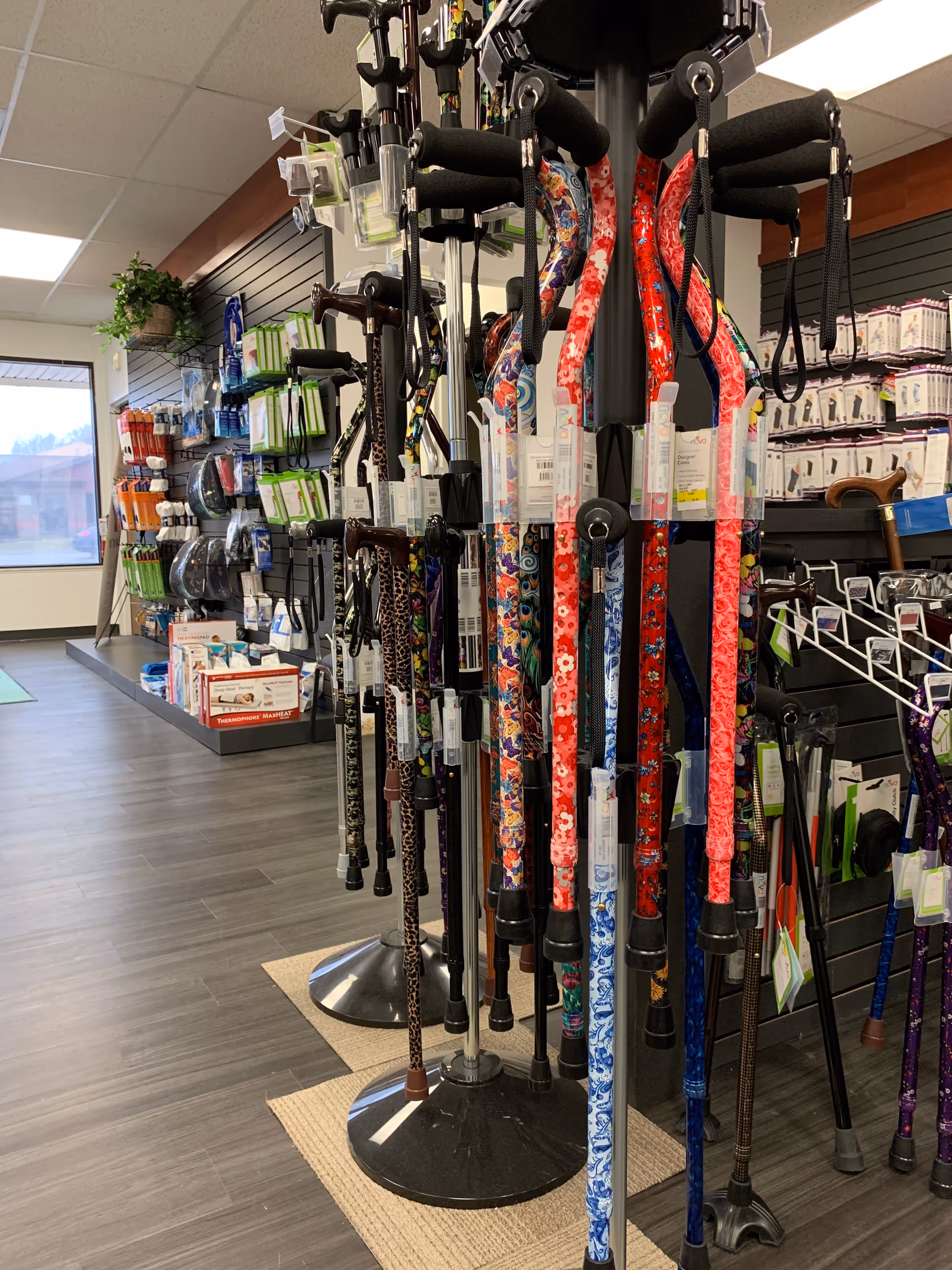 Inside a senior living facility shop, rows of walking canes and mobility aids on display.
