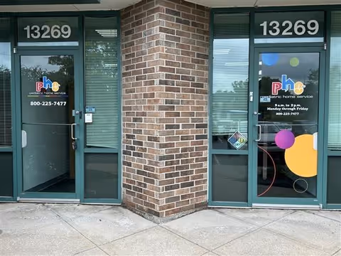 Exterior entrance with two glass doors separated by a brick column and the number 13269
