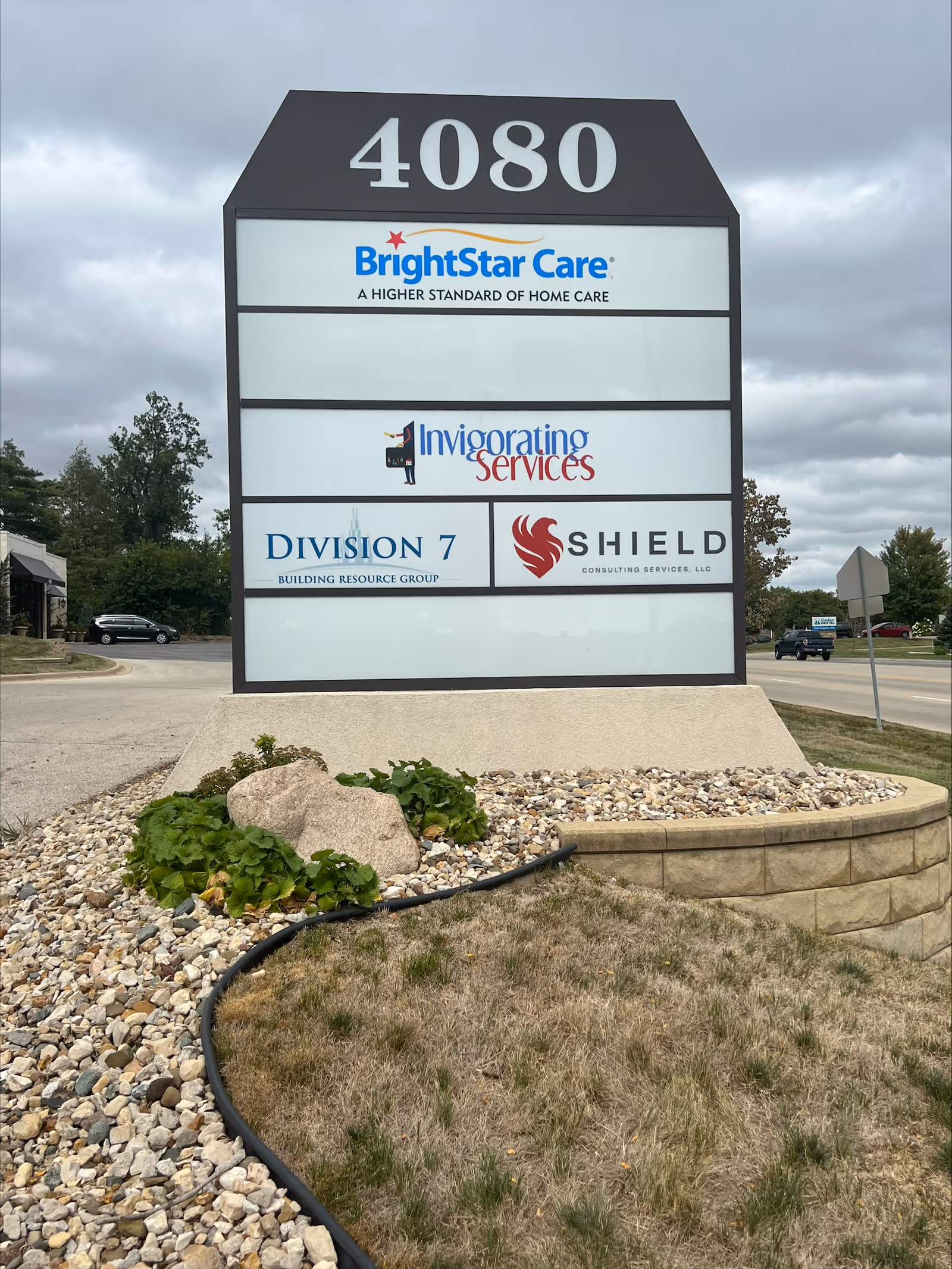 Large outdoor sign with BrightStar Care logos and 4080 street number.