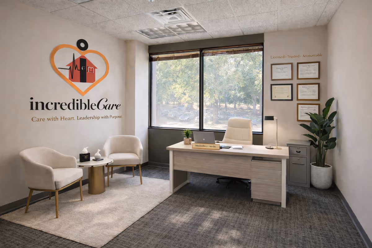 Reception area with desk, logo wall, seating, window view, and framed certificates.