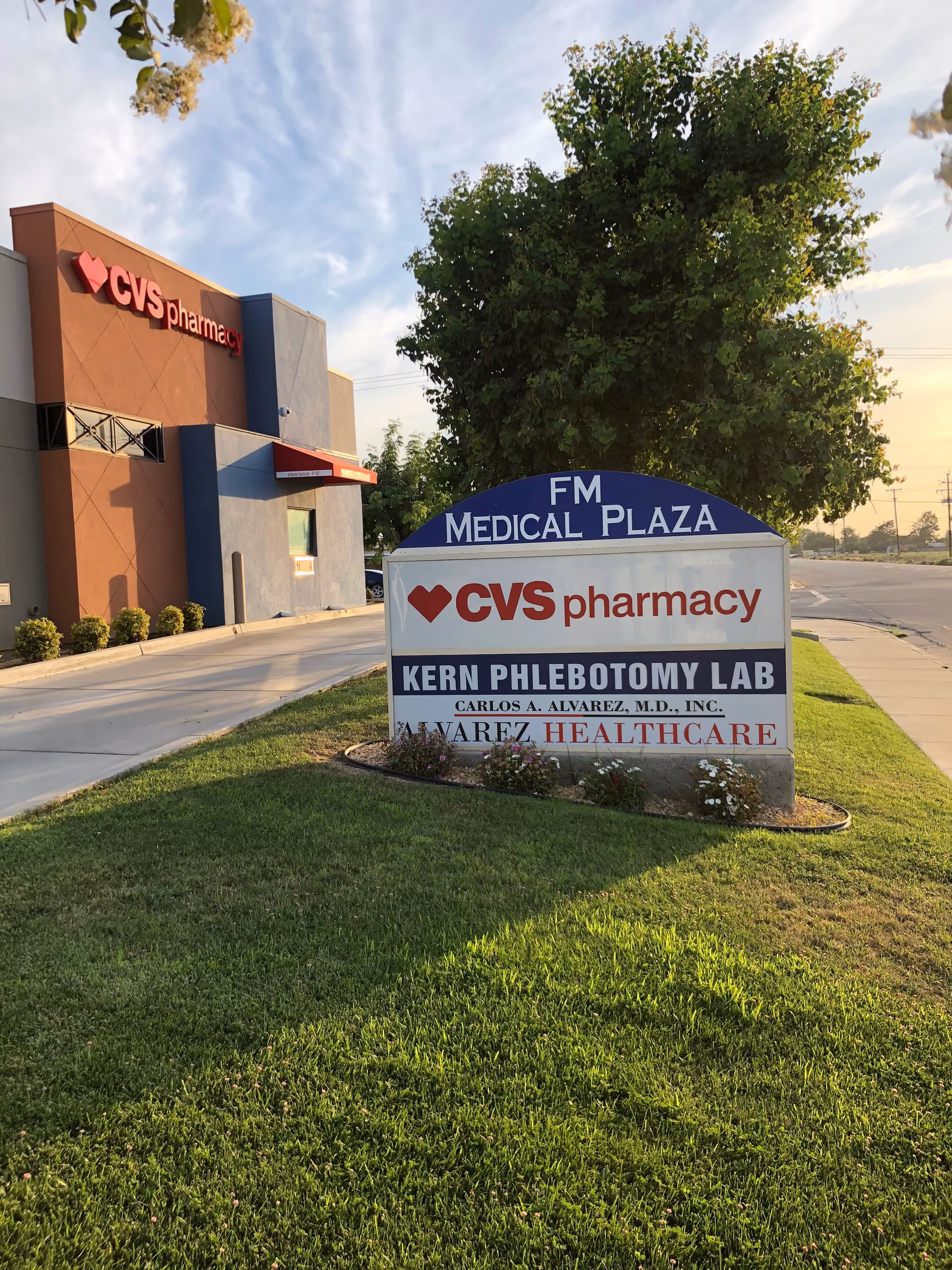 Exterior view of a CVS pharmacy and a Kern Phlebotomy Lab sign at a medical plaza.