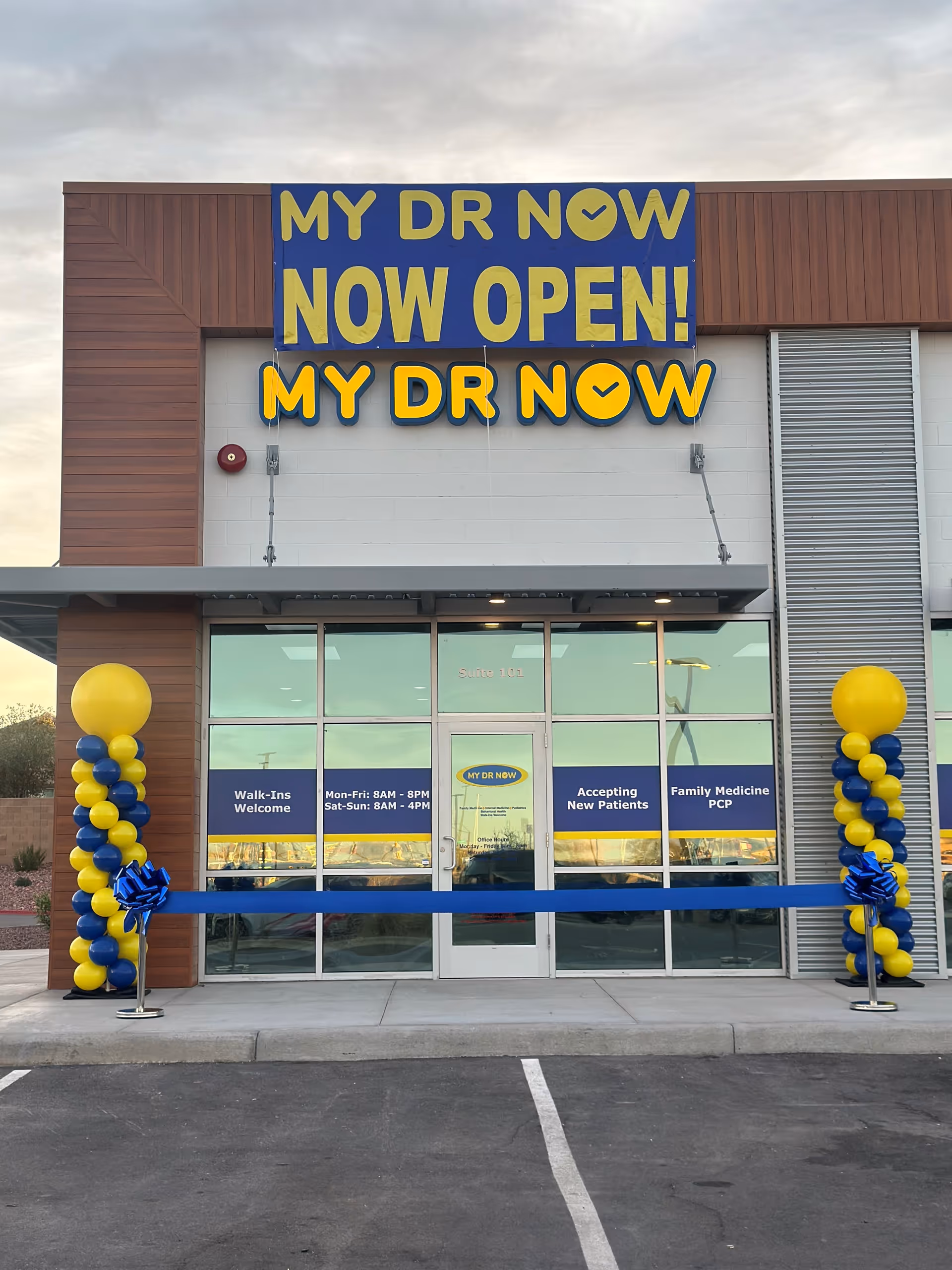Front of MY DR NOW clinic with large blue sign and ribbon.